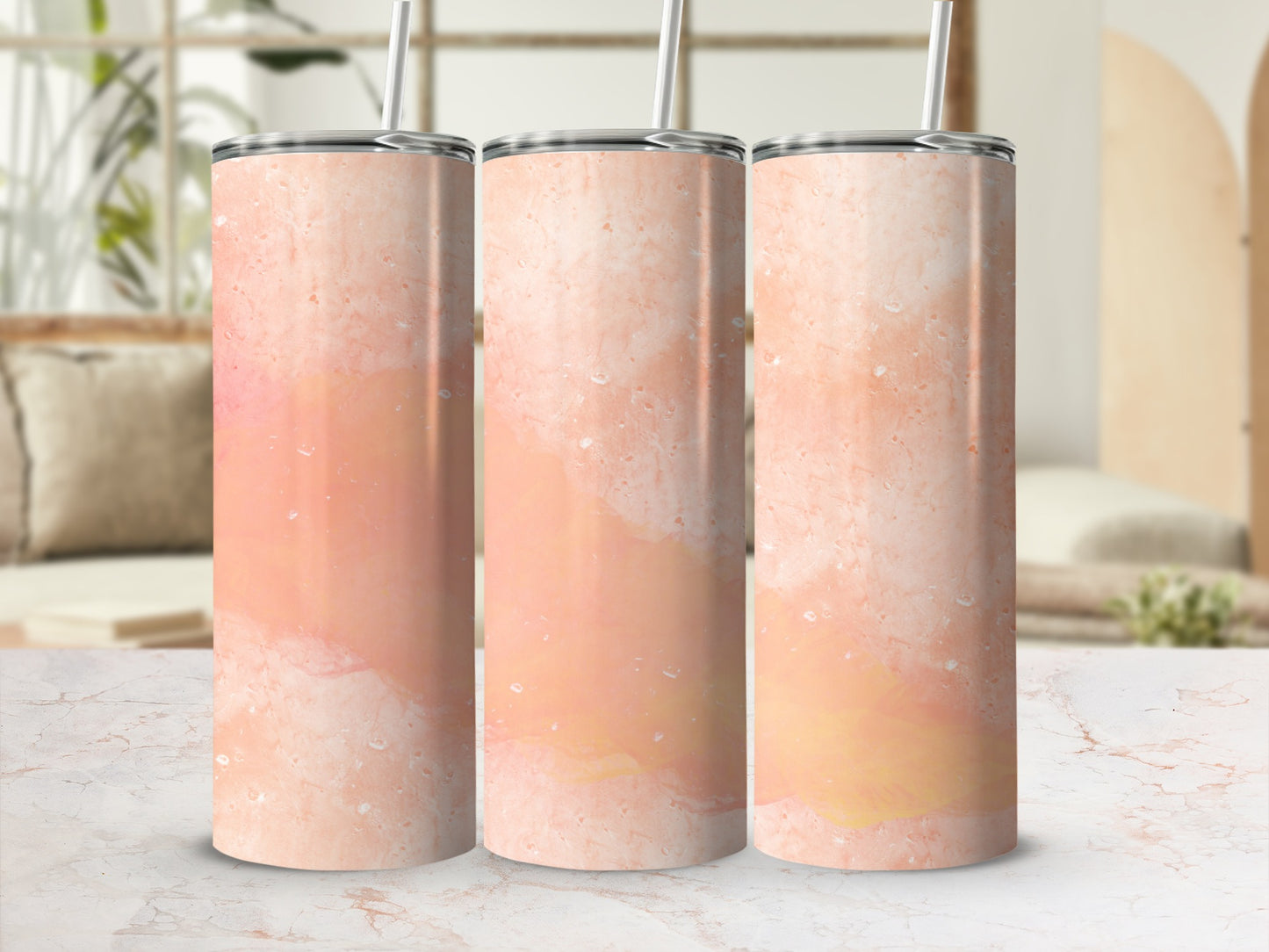 Three tall tumblers with a marbled pink and orange design.