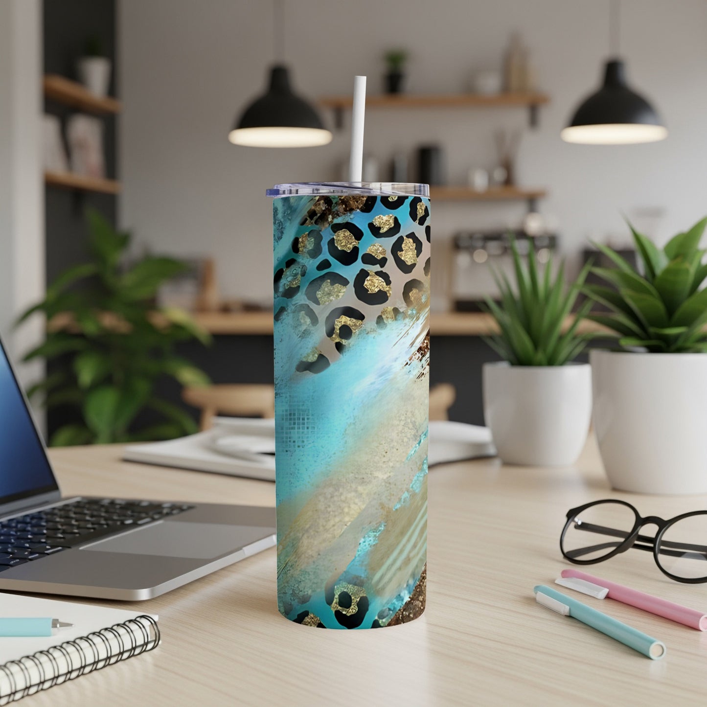 Turquoise tumbler with leopard print and gold accents.