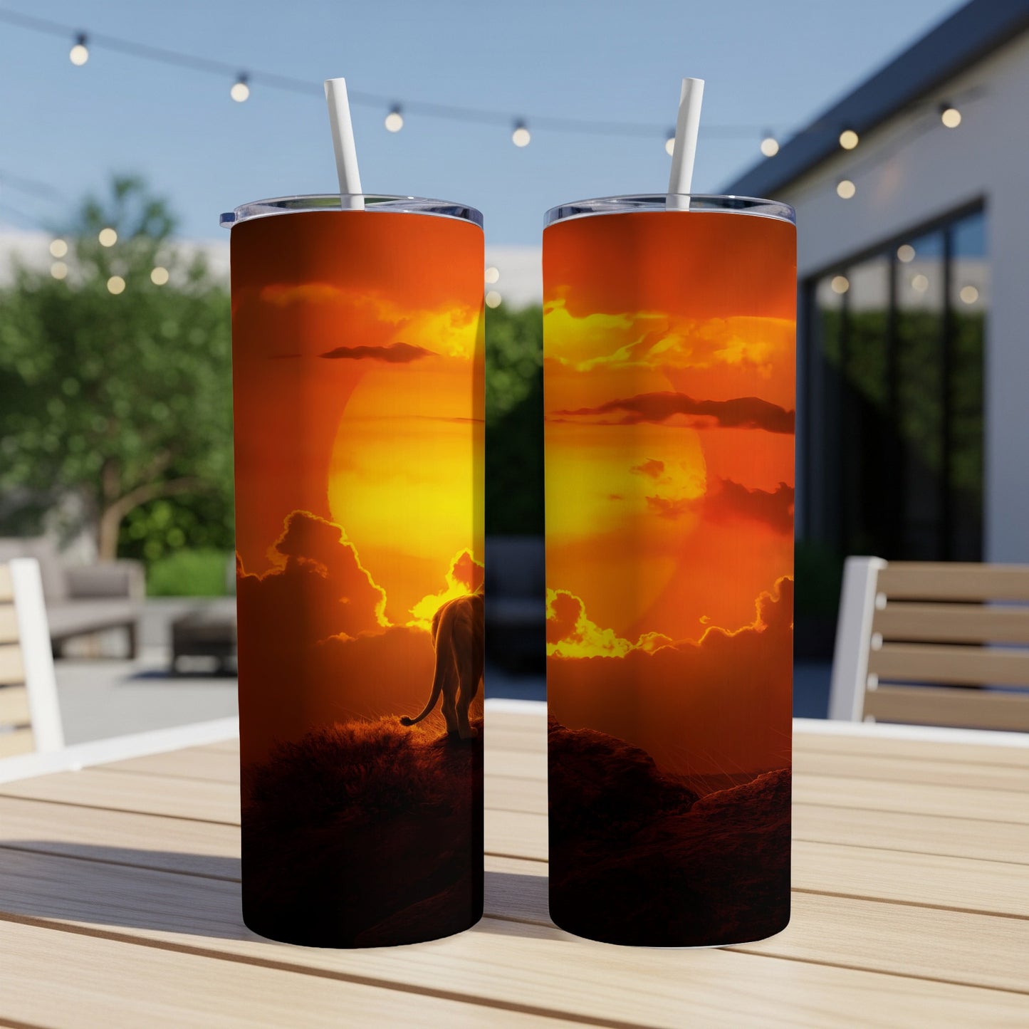 Lion silhouette against a vibrant sunset on a cylindrical tumbler.