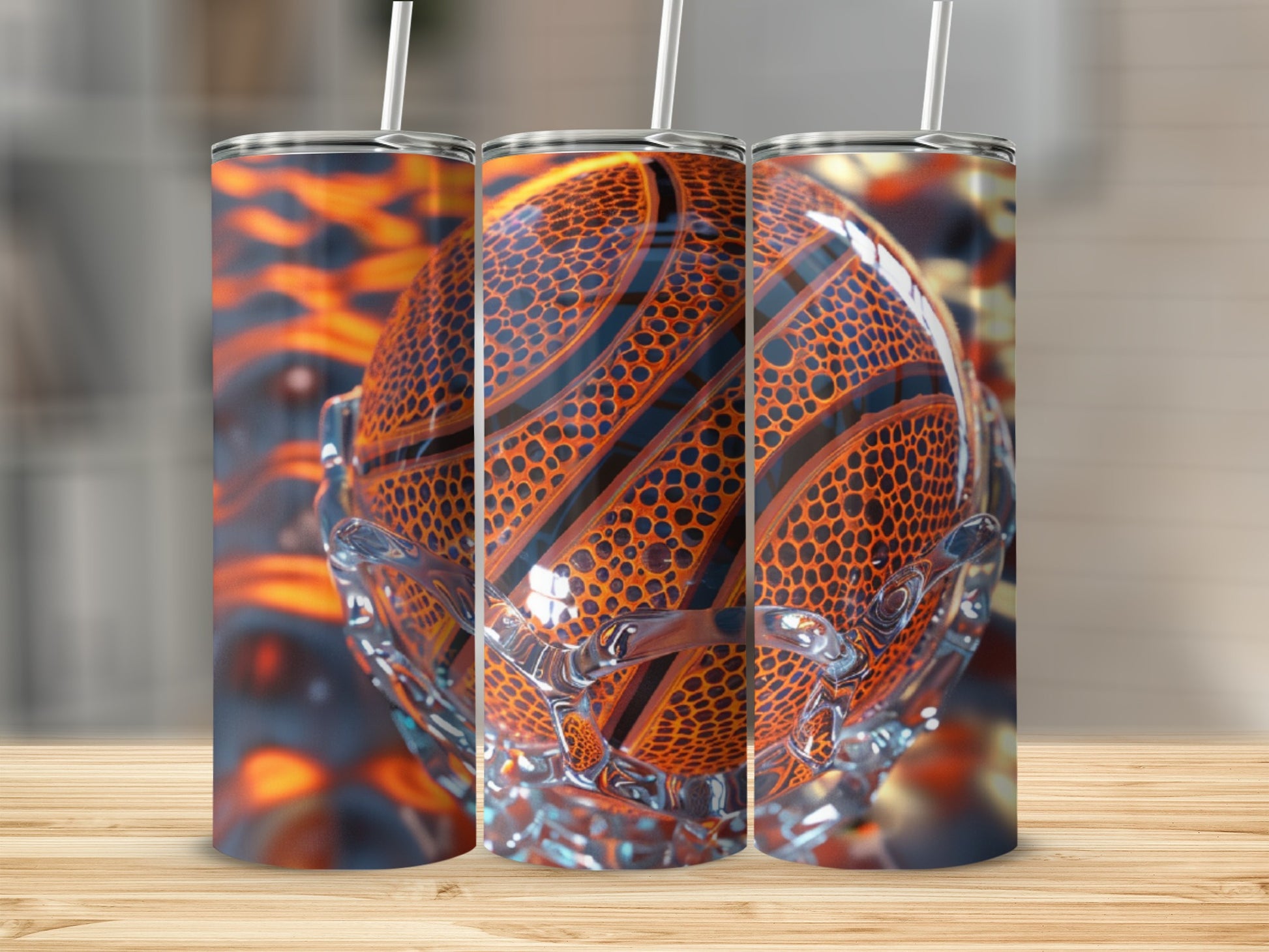 Three tumblers with a basketball design displayed on a wooden surface.