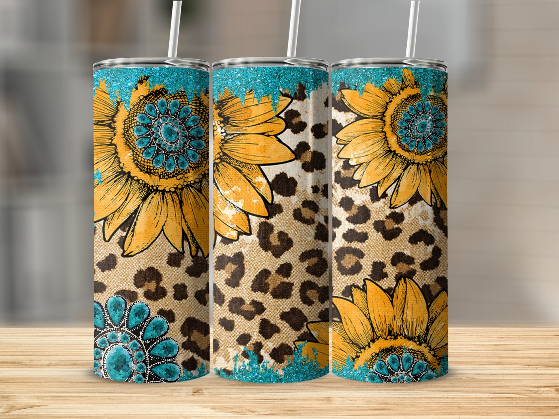 Three tumblers with sunflower and leopard print designs.