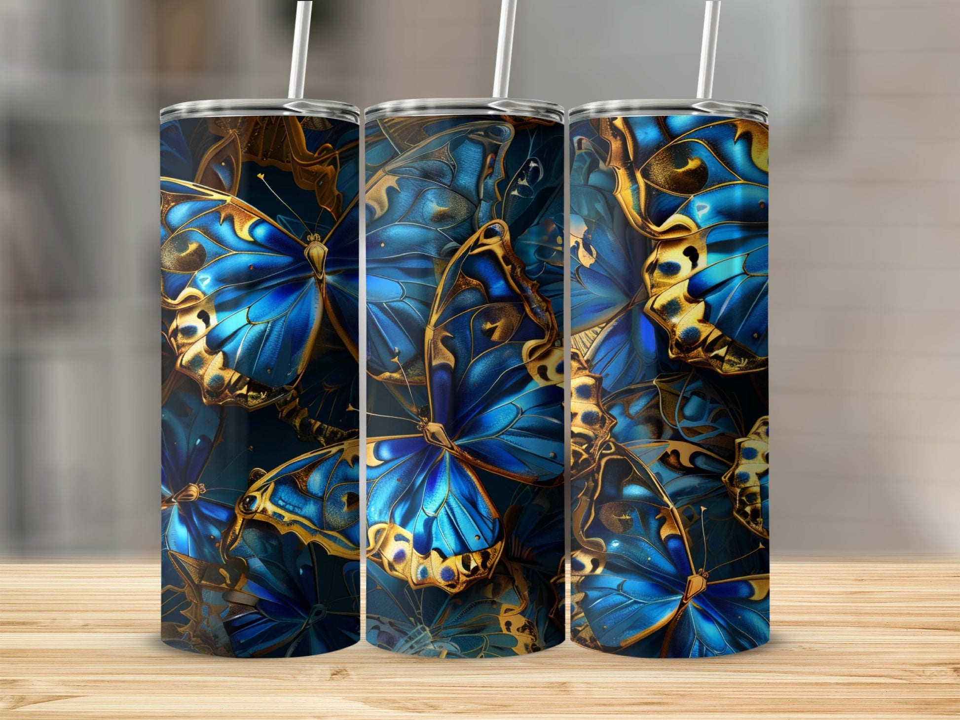 Three tumblers with a detailed blue and gold butterfly pattern.