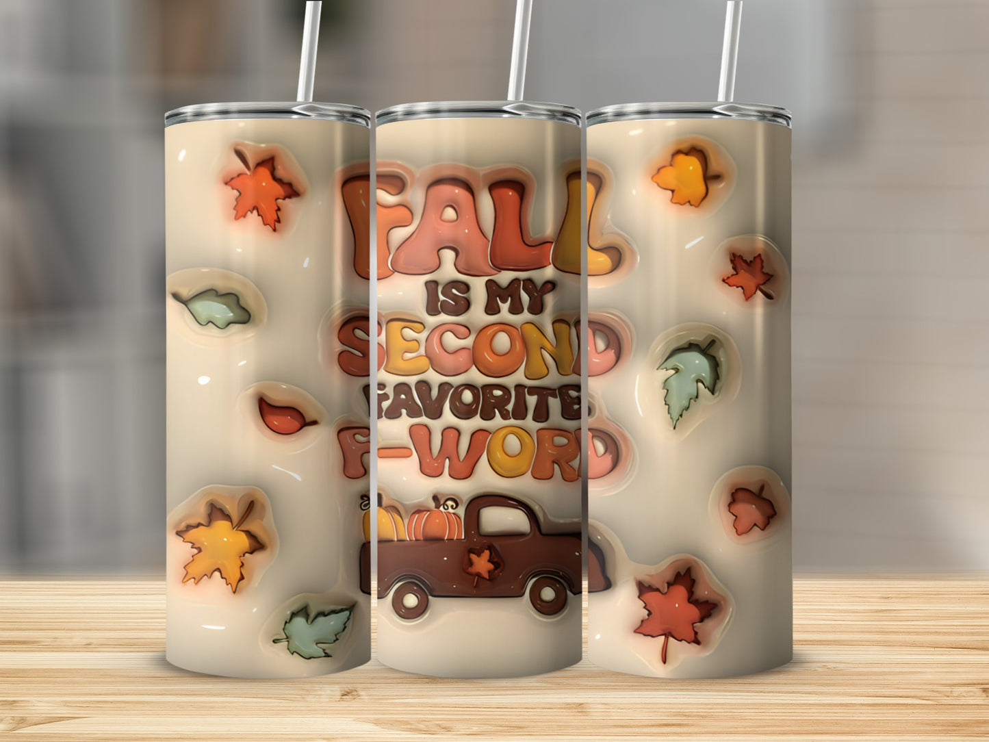 Tumbler with "Fall is my second favorite F-word" text and fall leaves.