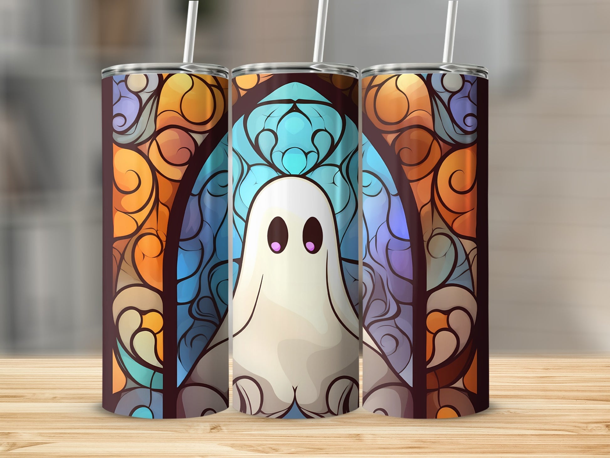 Three tumblers featuring a cute ghost and stained-glass pattern.