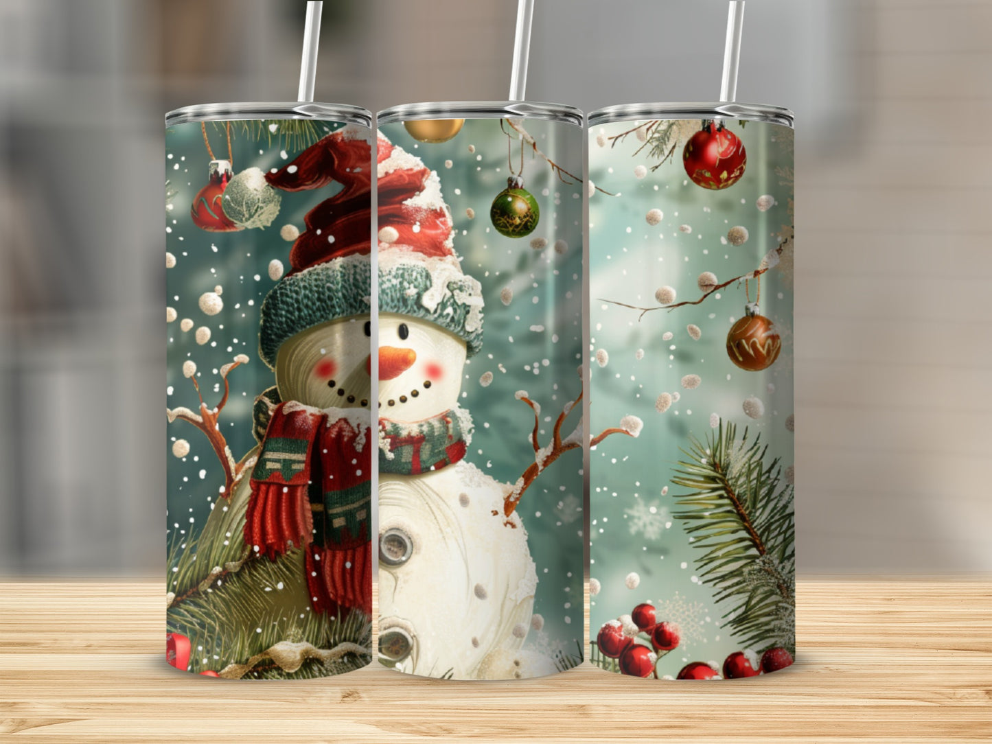 Three tumblers with snowman and holiday ornaments design.
