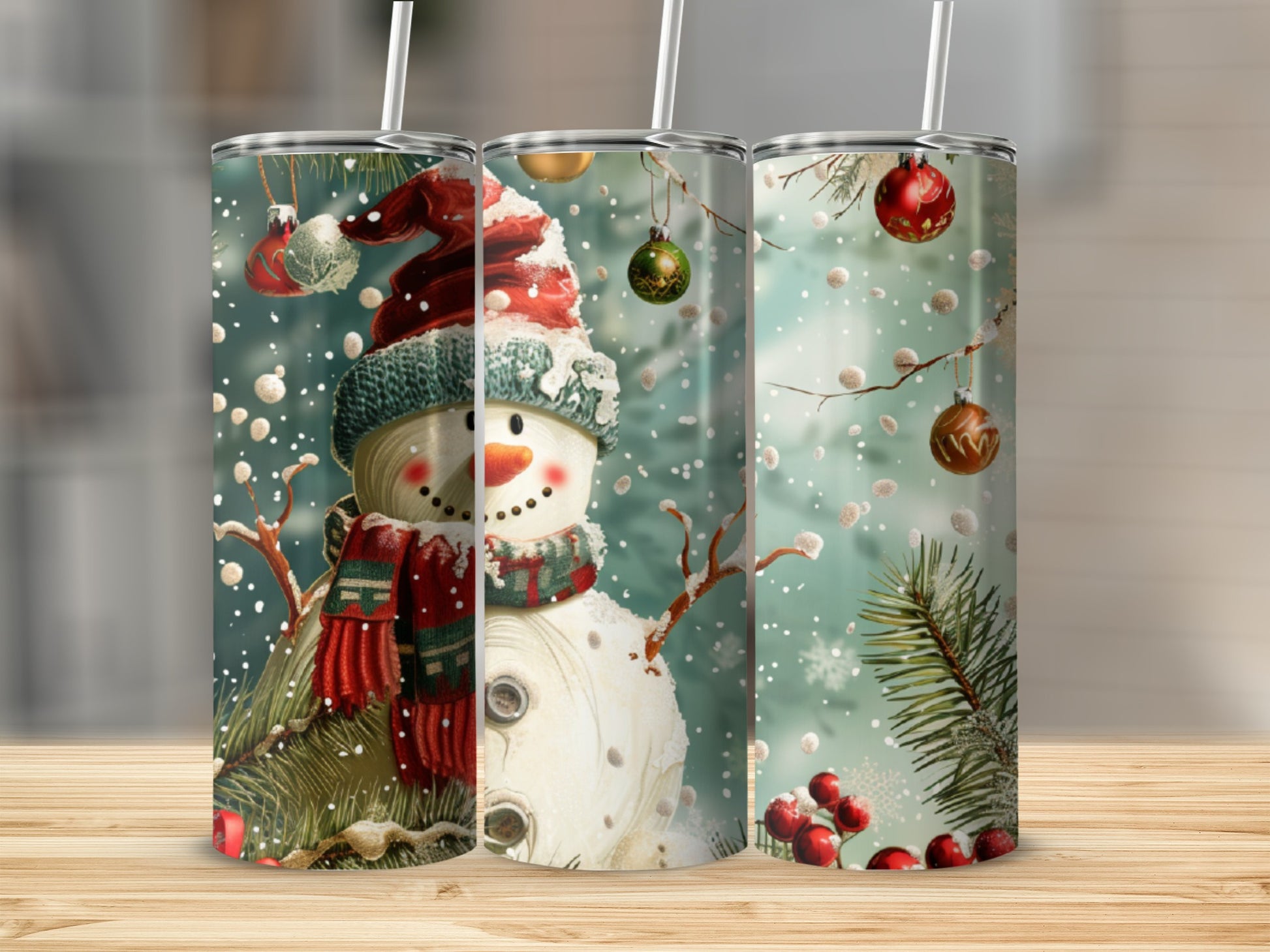 Three tumblers with snowman and holiday ornaments design.