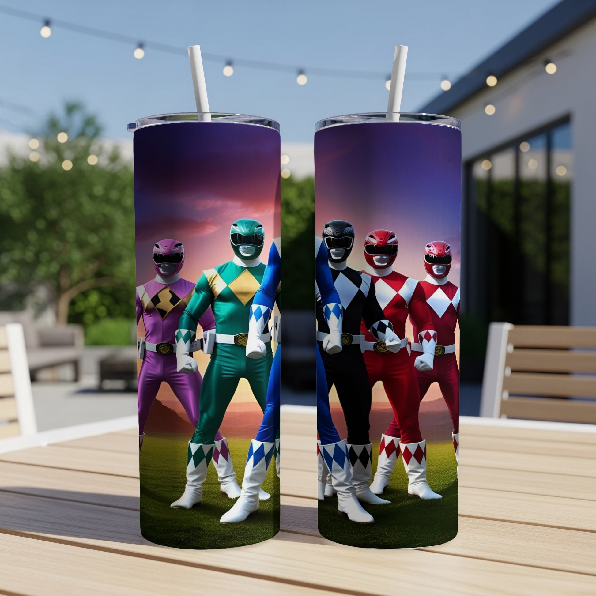 Two Power Rangers tumblers with characters in colorful suits standing on a table.
