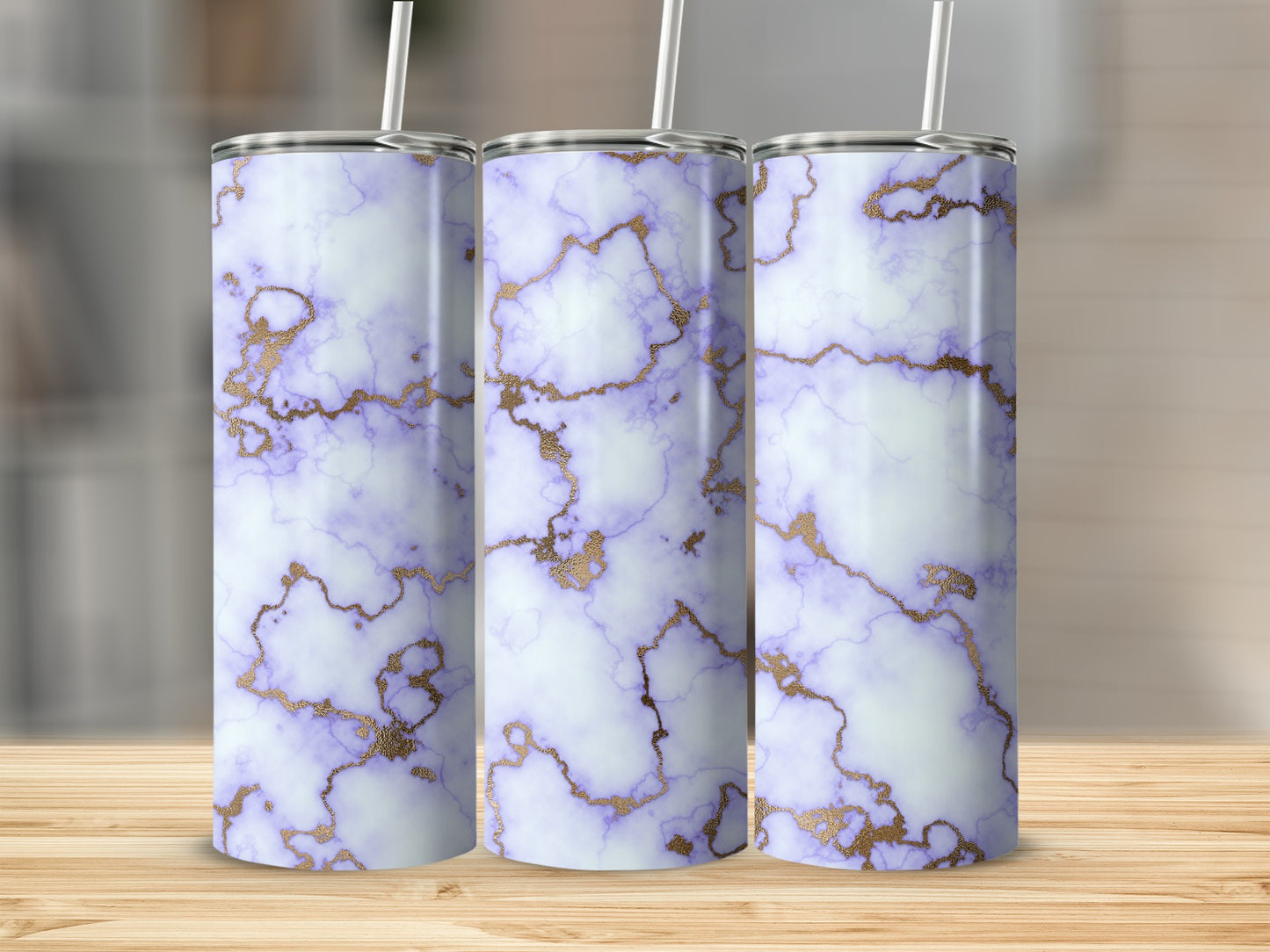 Three tumblers with purple and gold marble pattern on wooden surface.