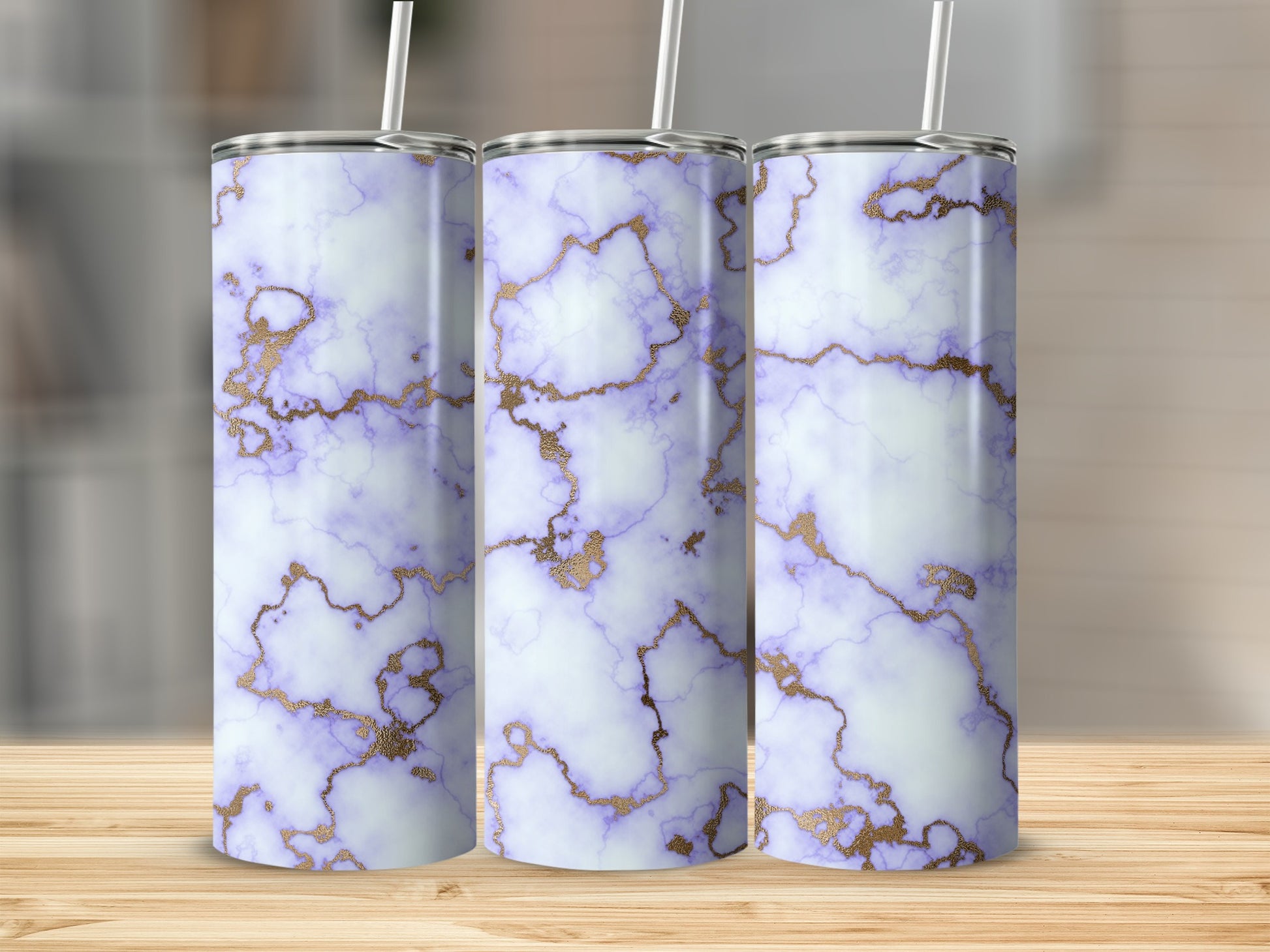 Three tumblers with purple and gold marble pattern on wooden surface.