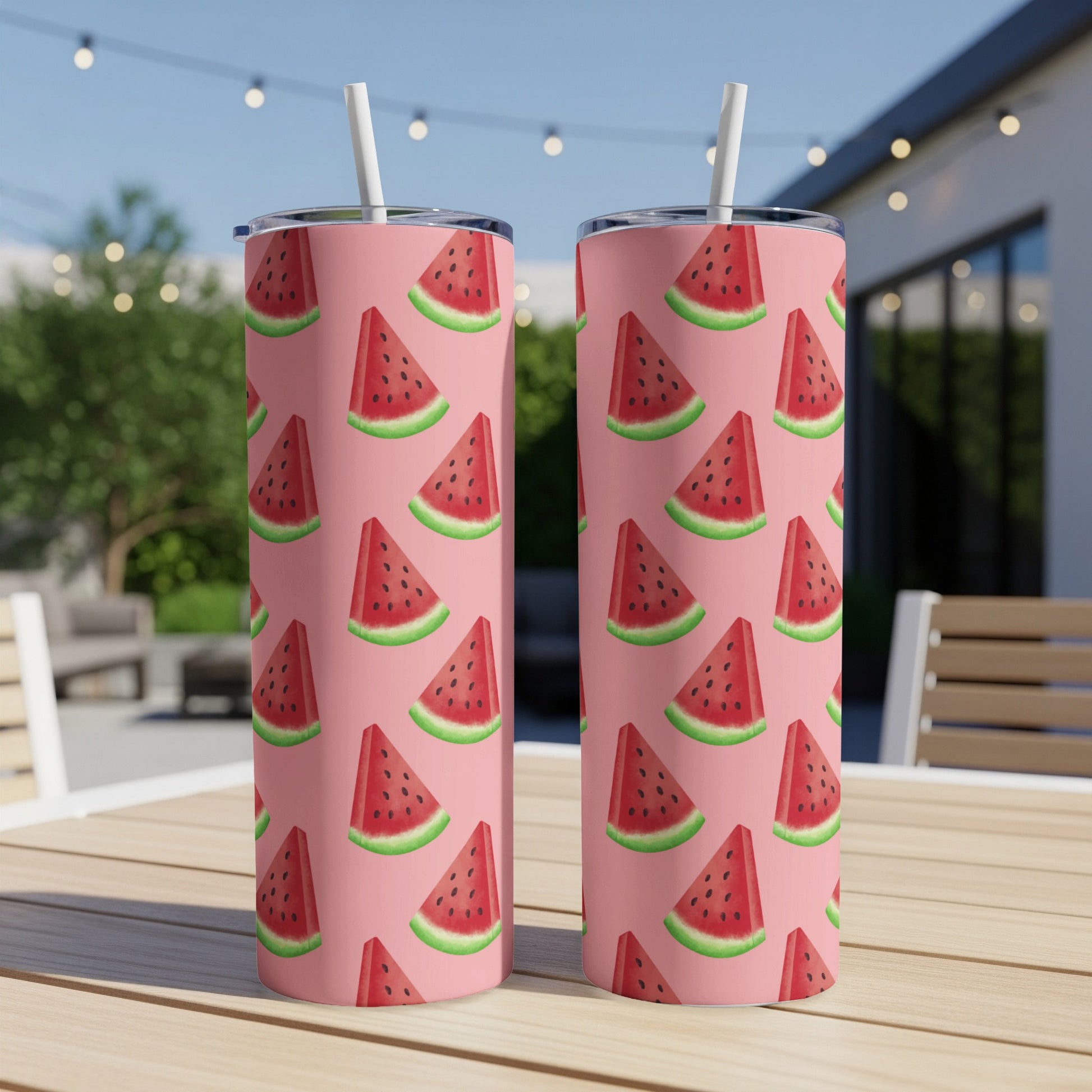 Two pink tumblers with a repeating pattern of watermelon slices.
