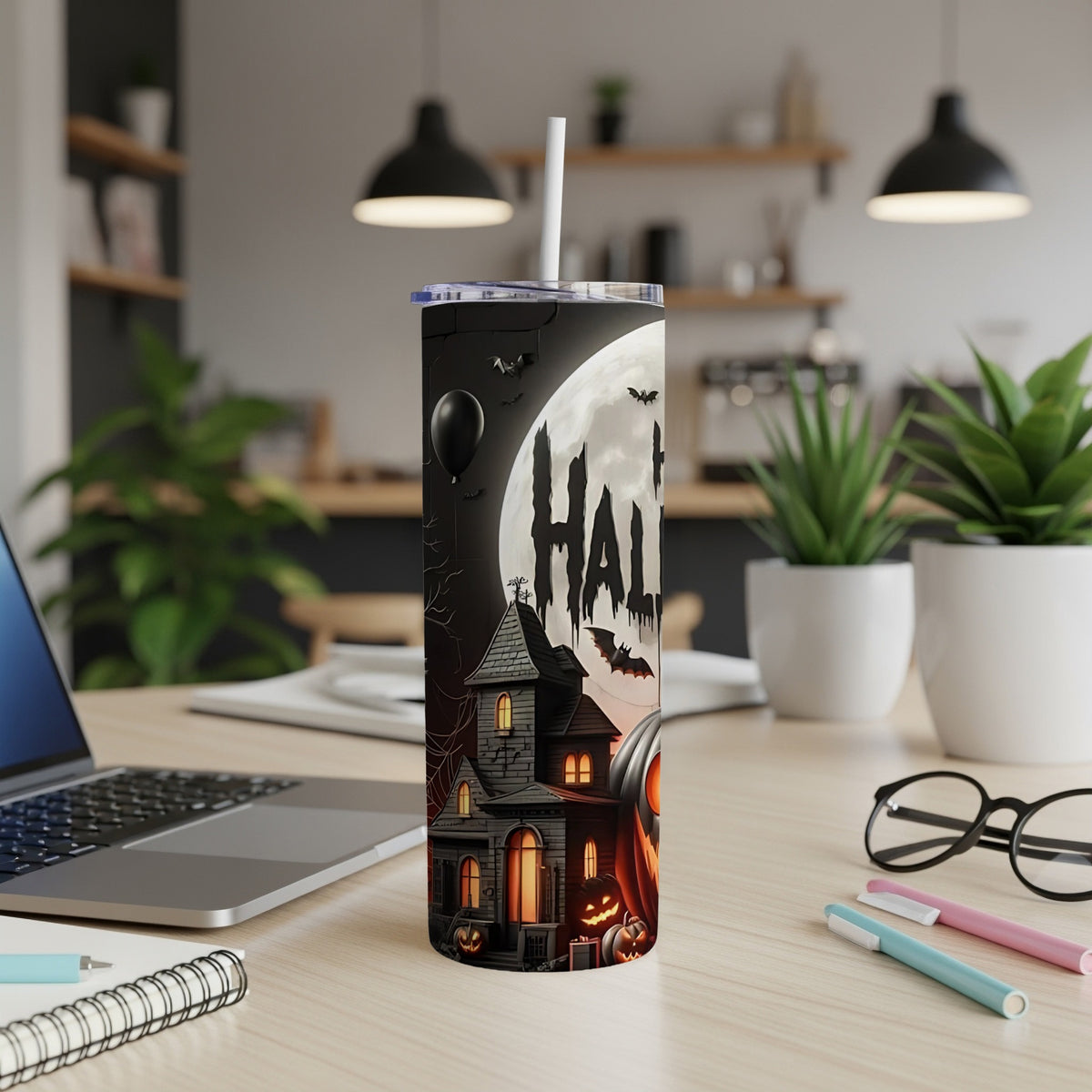 Halloween tumbler with haunted house, jack-o'-lanterns, bats, and moon.