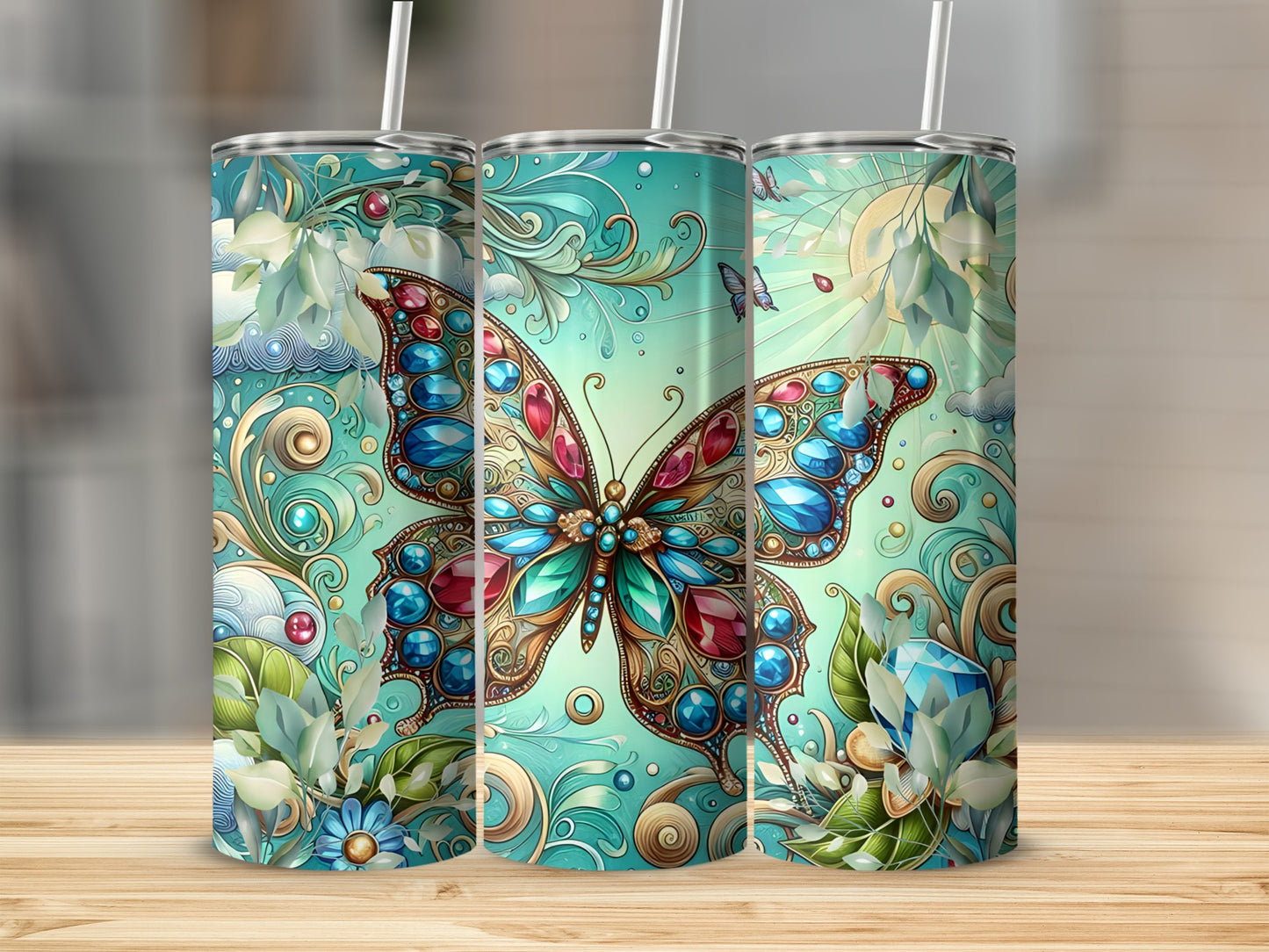 Turquoise tumbler with ornate butterfly and floral designs.