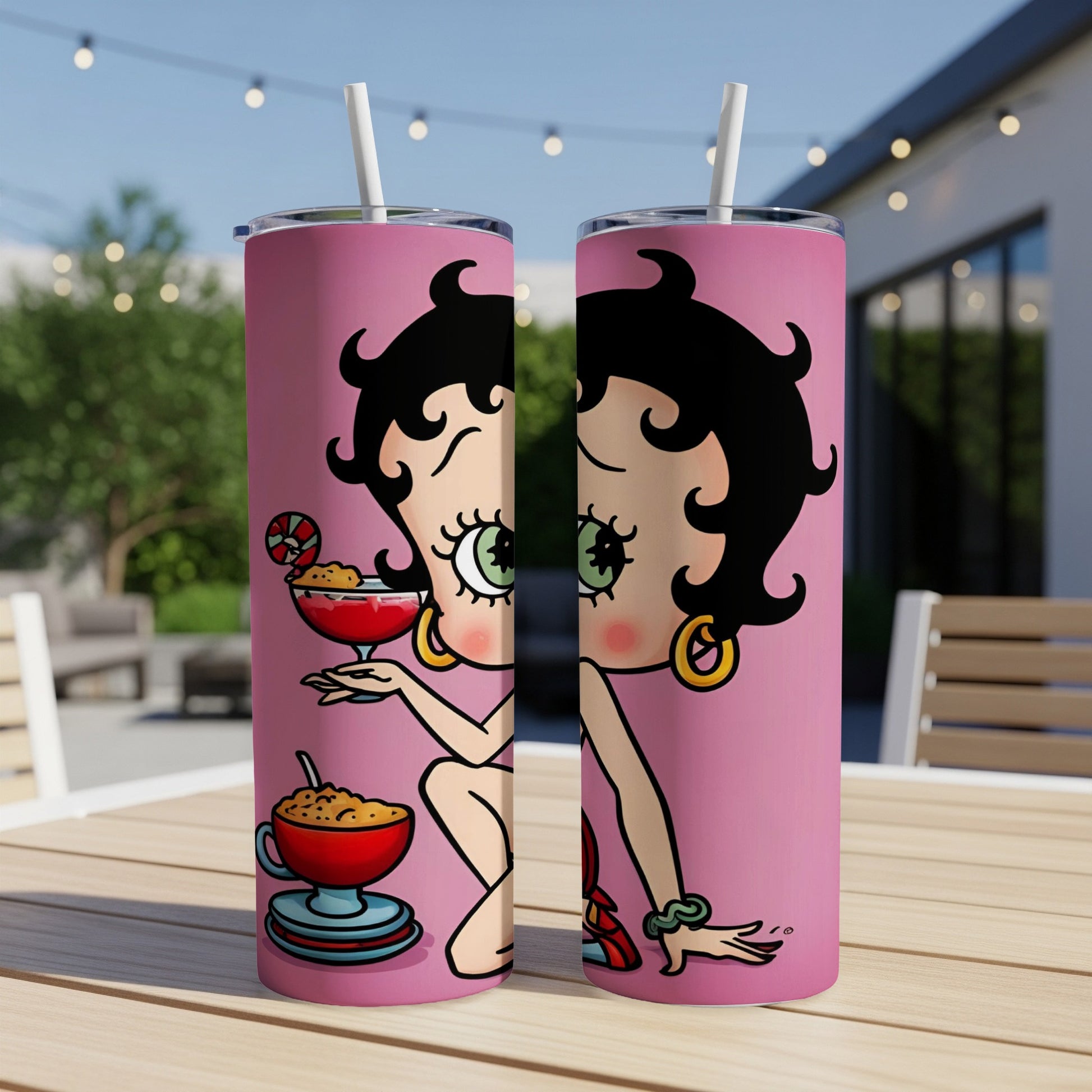 Betty Boop with cocktail and martini on pink background.