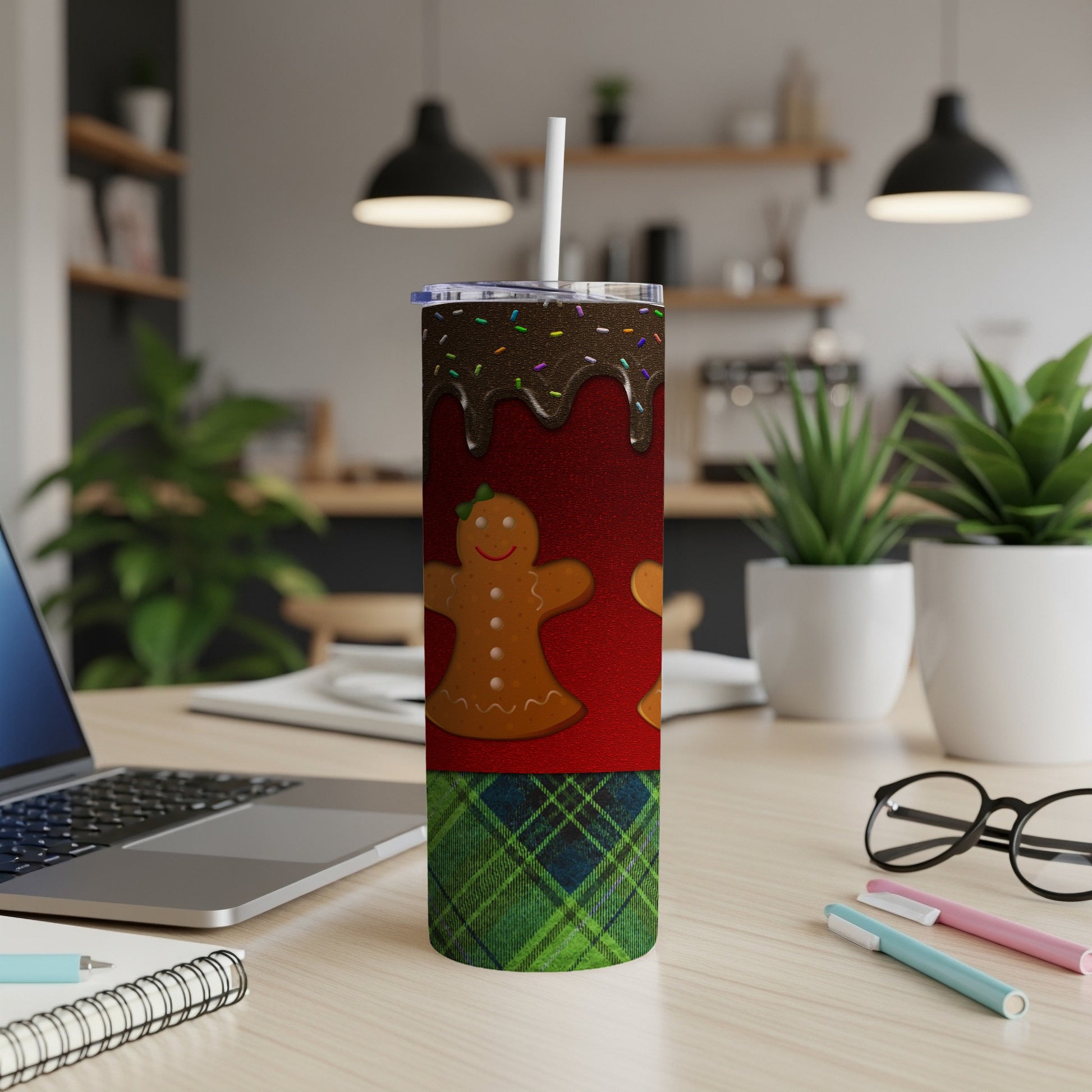 Christmas tumbler with gingerbread man, sprinkles, and plaid pattern.