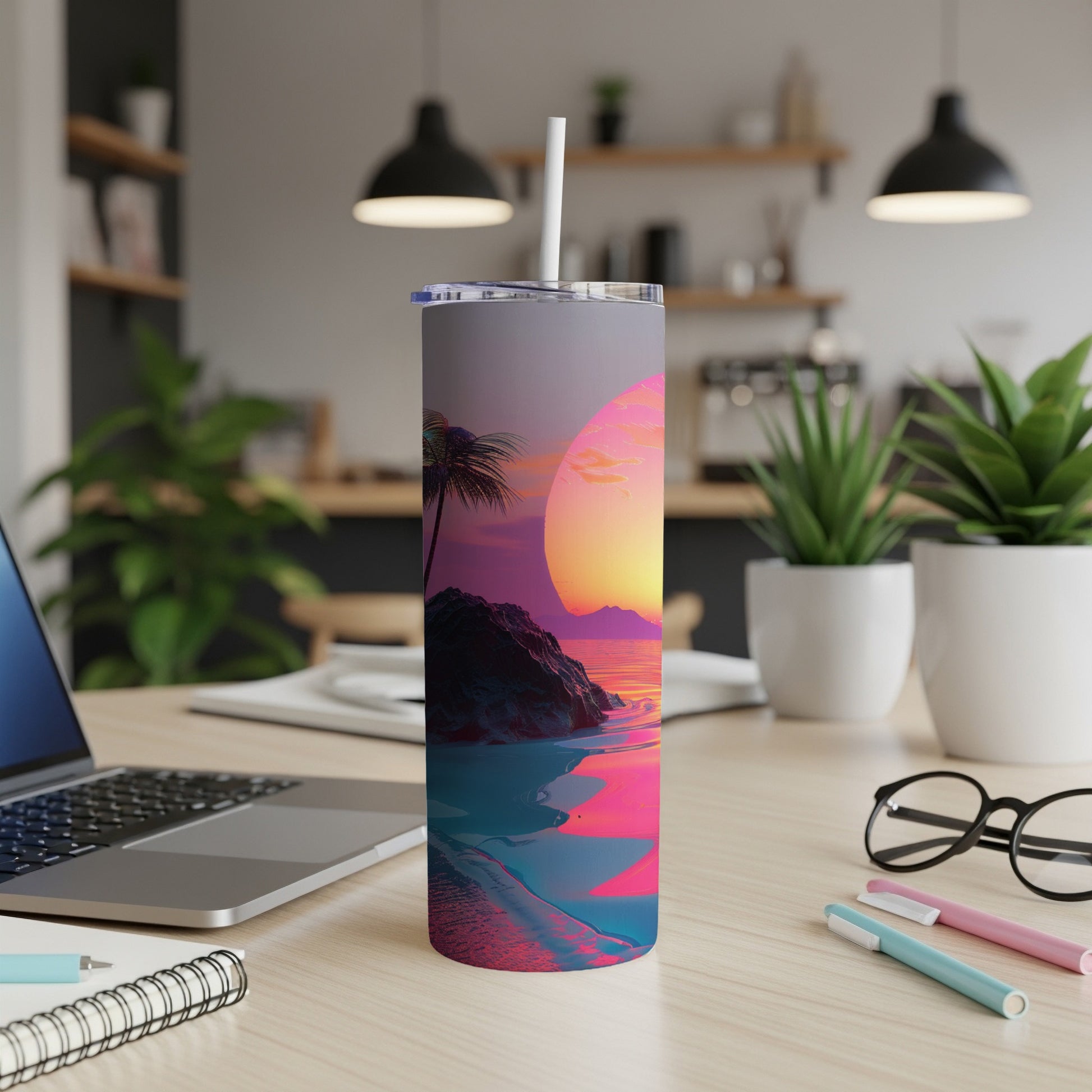 Tumbler with sunset beach scene and palm trees.