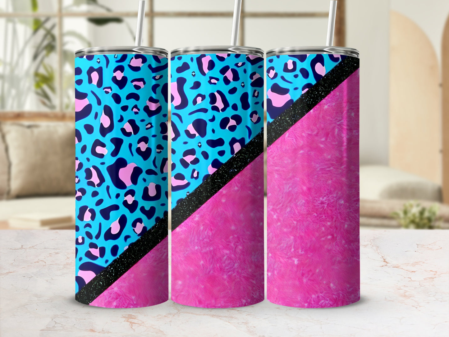 Blue leopard print tumbler with pink textured bottom and black glitter stripe.