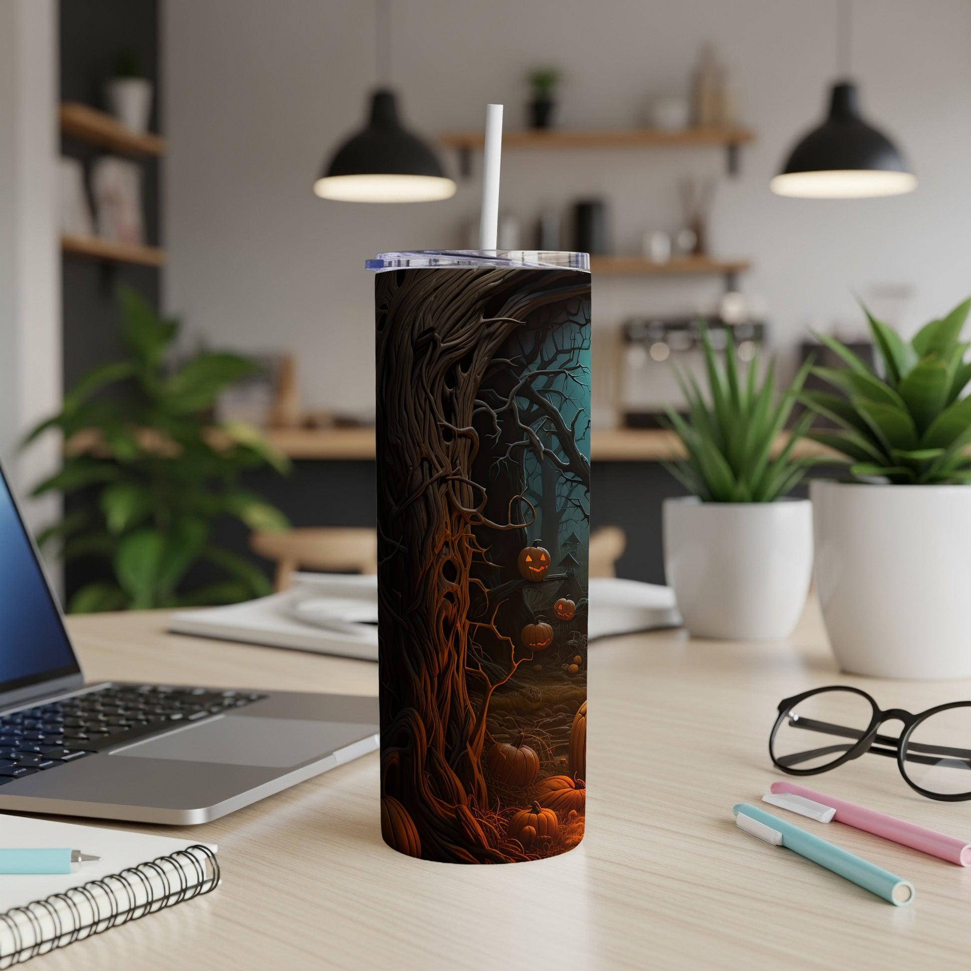 Tumbler with a spooky Halloween forest scene and carved pumpkins design.