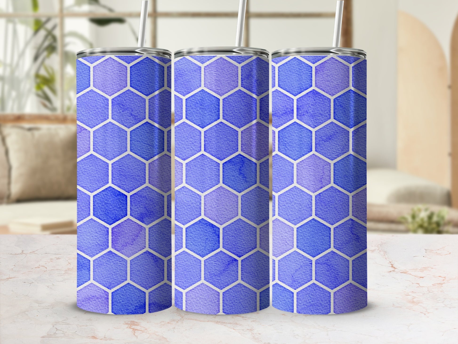 Three tumblers with a blue and purple honeycomb watercolor pattern.