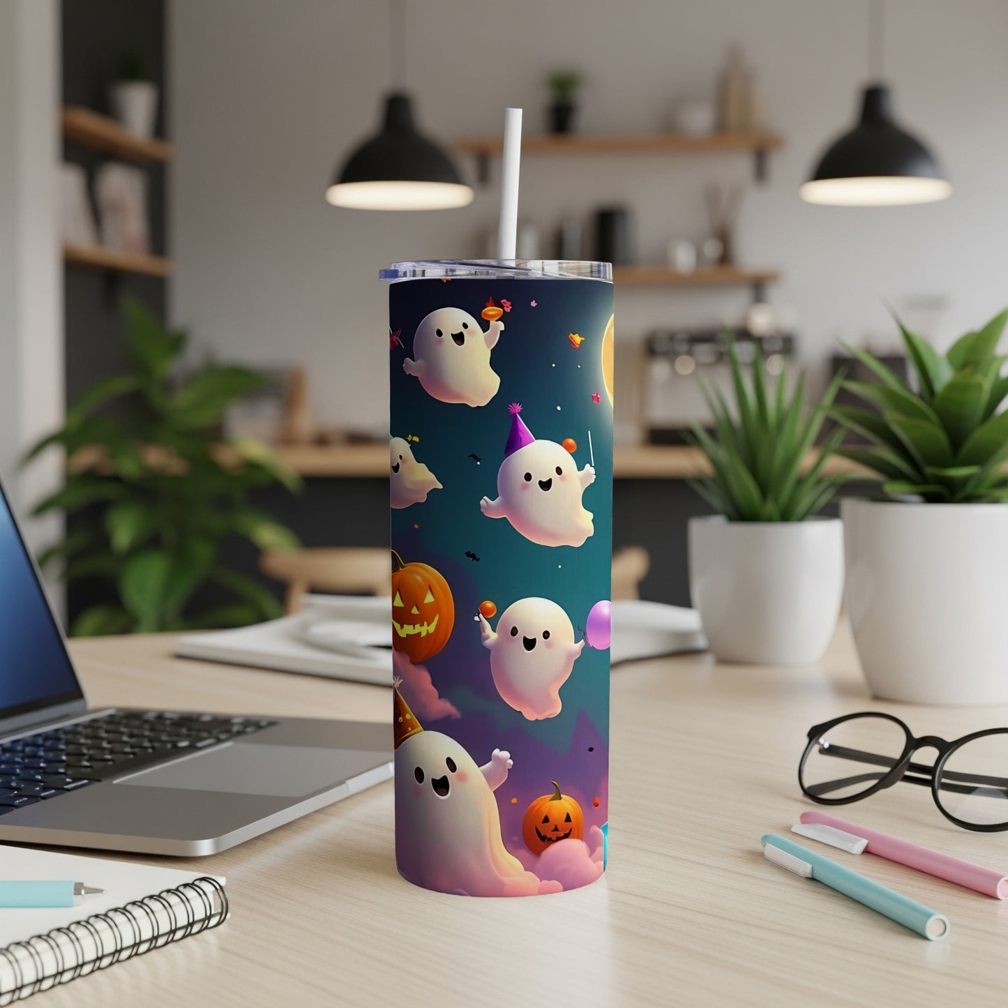 Tumbler with a Halloween design of cute ghosts, pumpkins, and party hats.