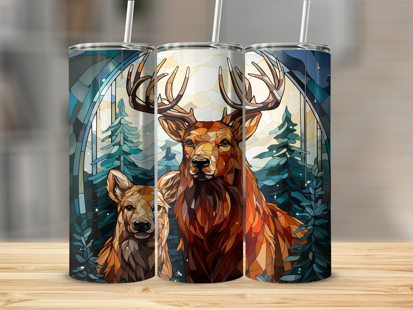 Three tumblers featuring a deer and fawn against a stained-glass forest backdrop.