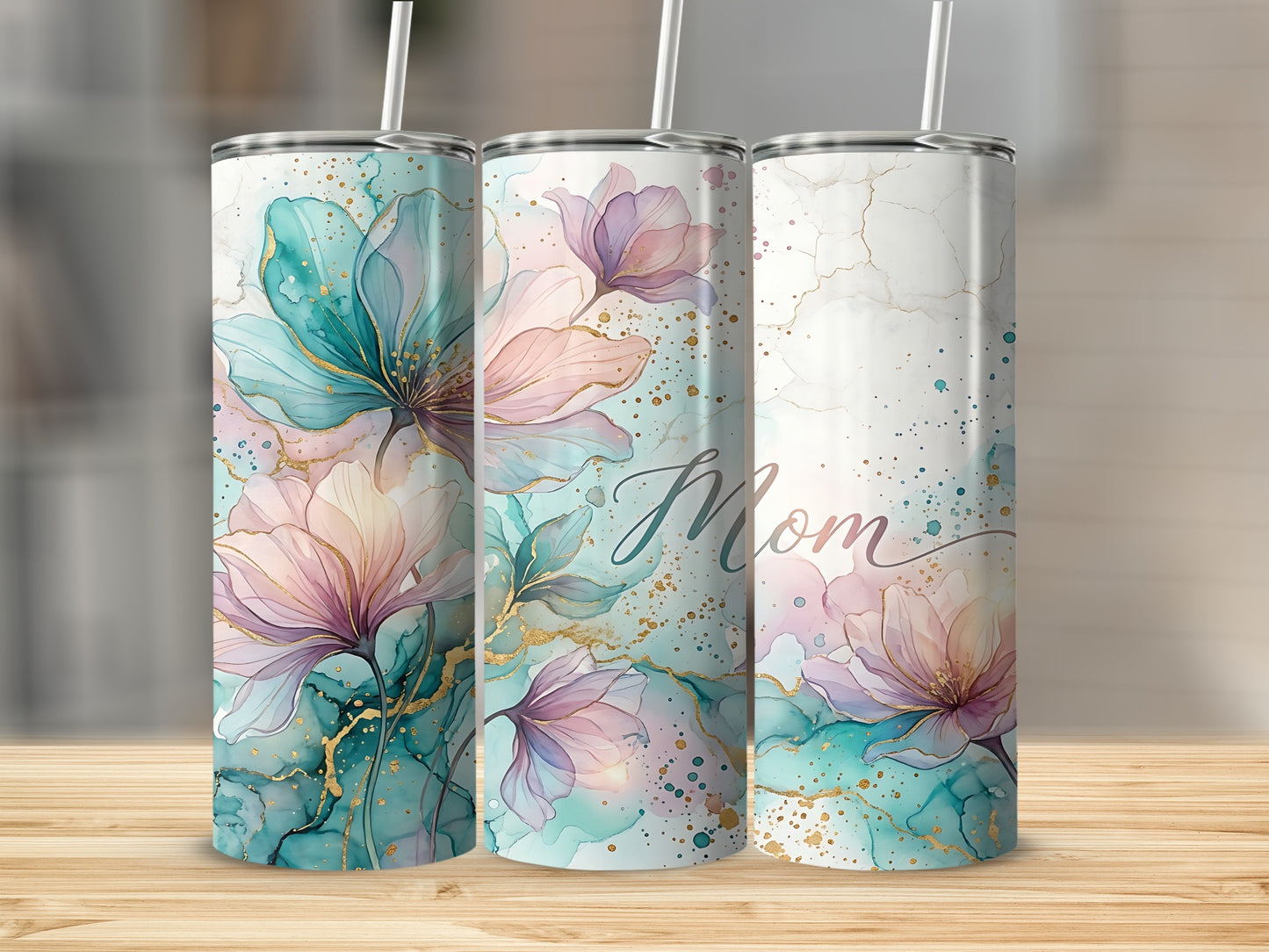 Three tall tumblers with watercolor floral designs and "Mom" text.