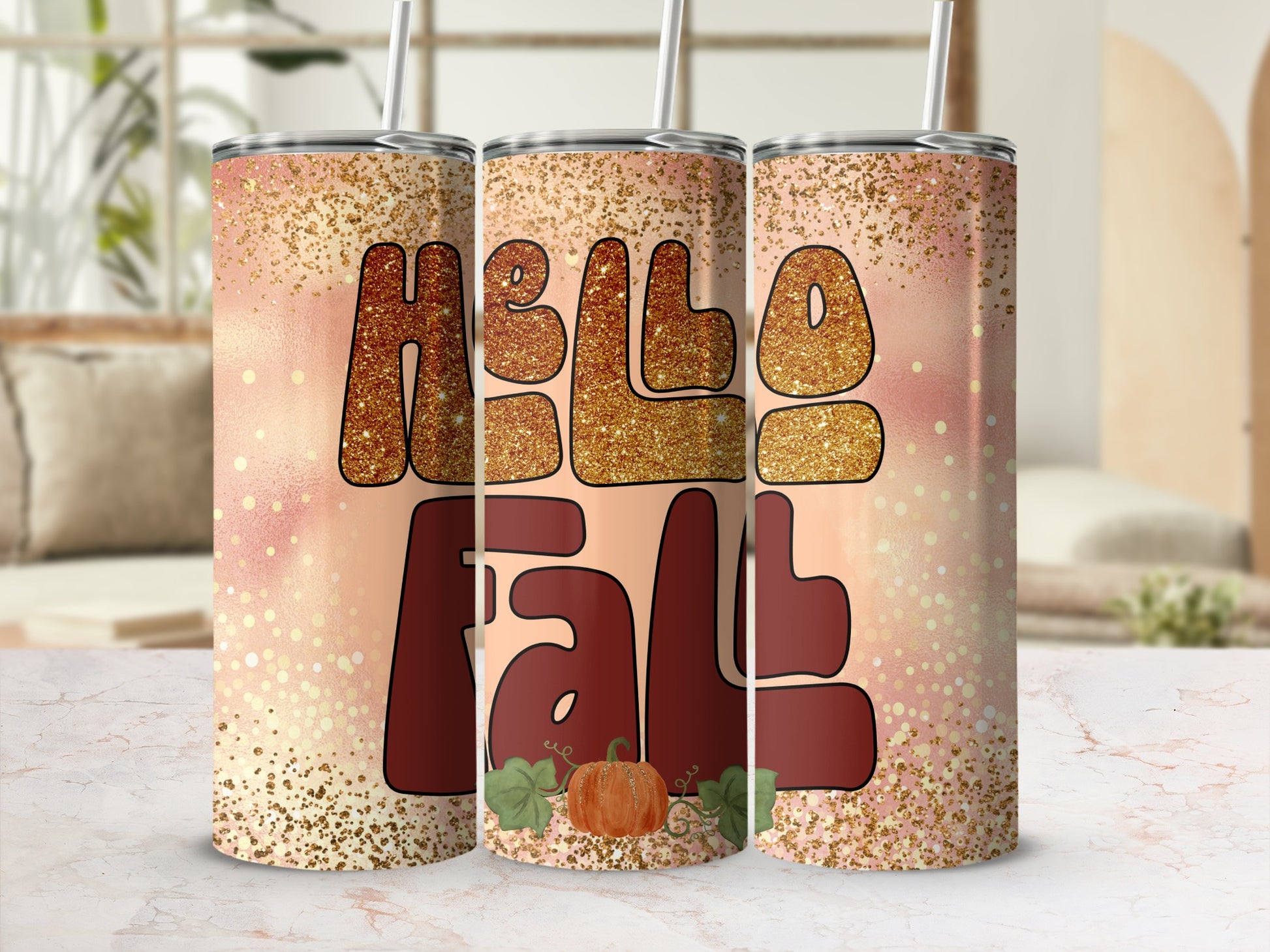 "Hello Fall" text with pumpkin and glitter on a tumbler.