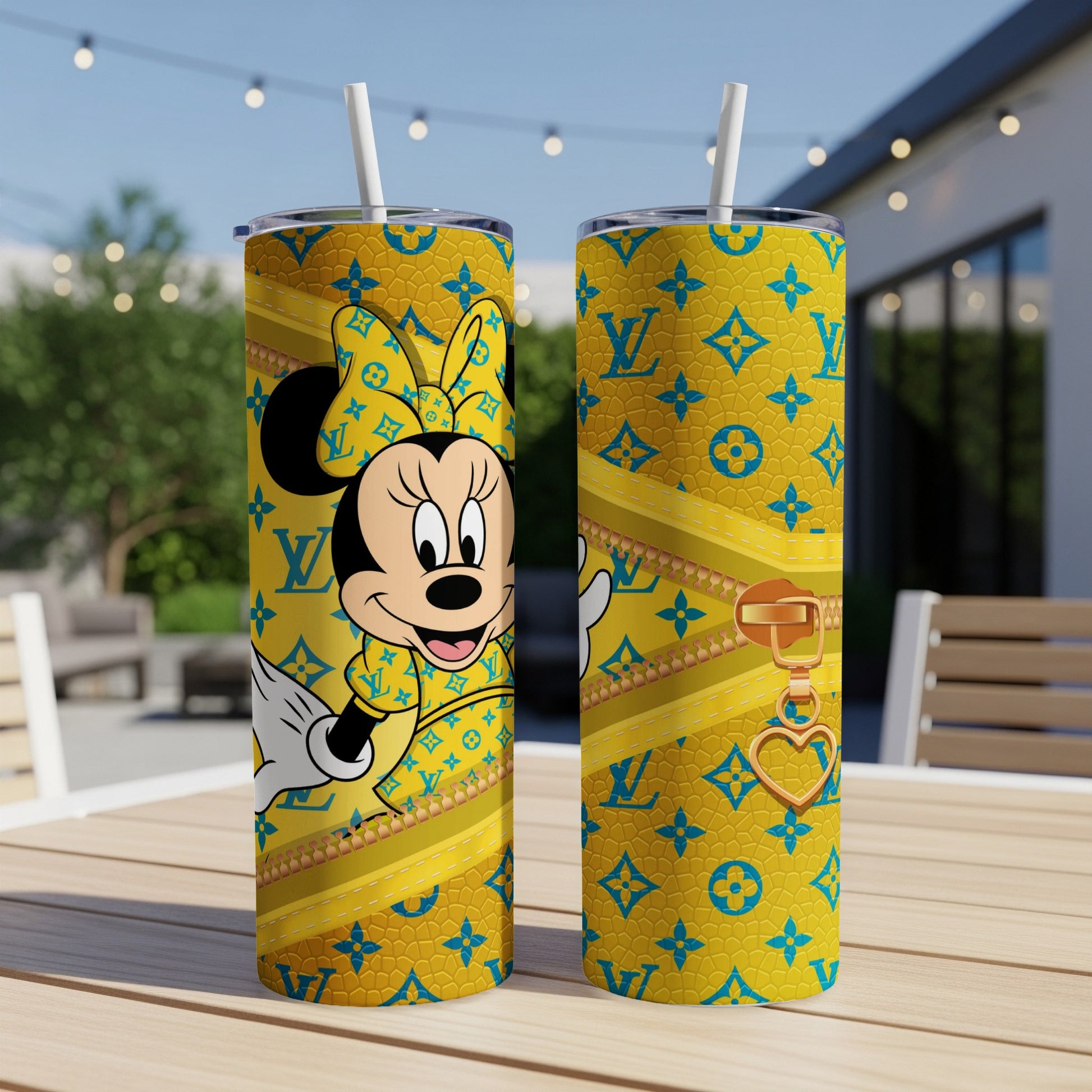 Minnie Mouse on yellow tumbler with LV-inspired pattern and gold zipper.
