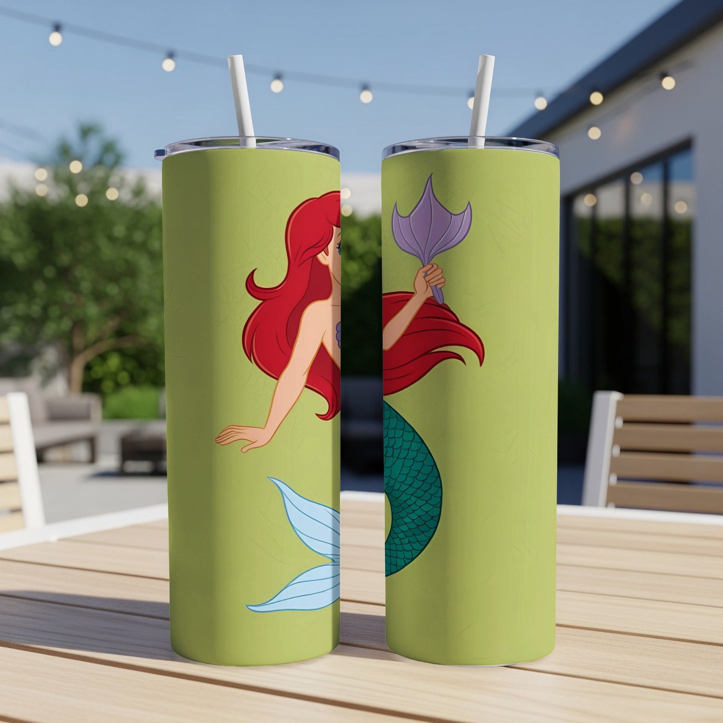 Ariel the mermaid on a lime green tumbler with a straw.