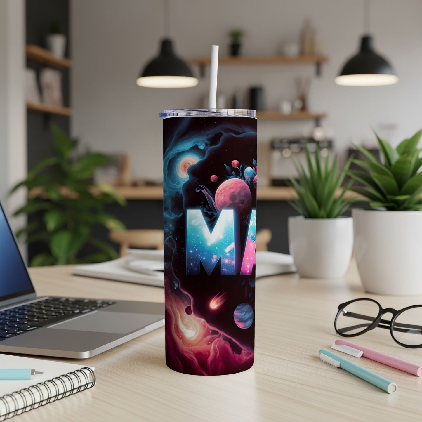 Tall tumbler with a vibrant cosmic design and "MA" text.