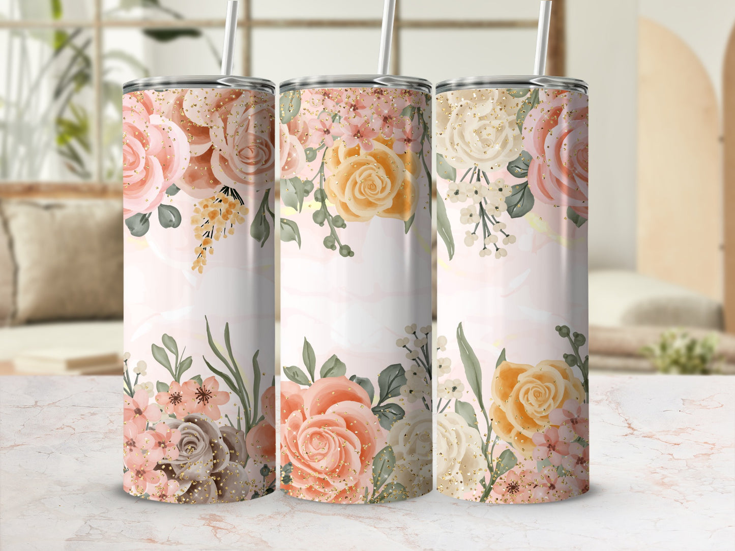 Tumbler with pink and yellow floral design and gold glitter accents.
