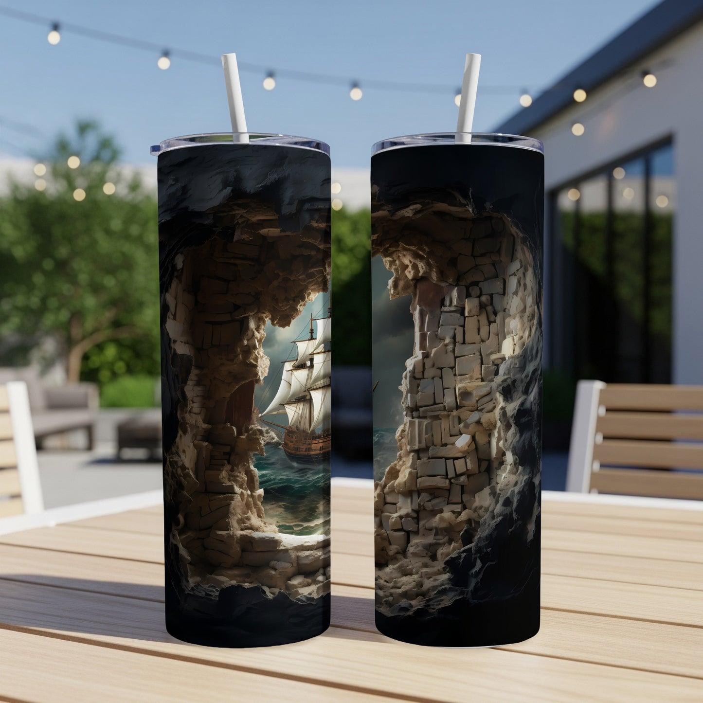 Two tumblers displaying a ship sailing through a rocky cavern entrance.