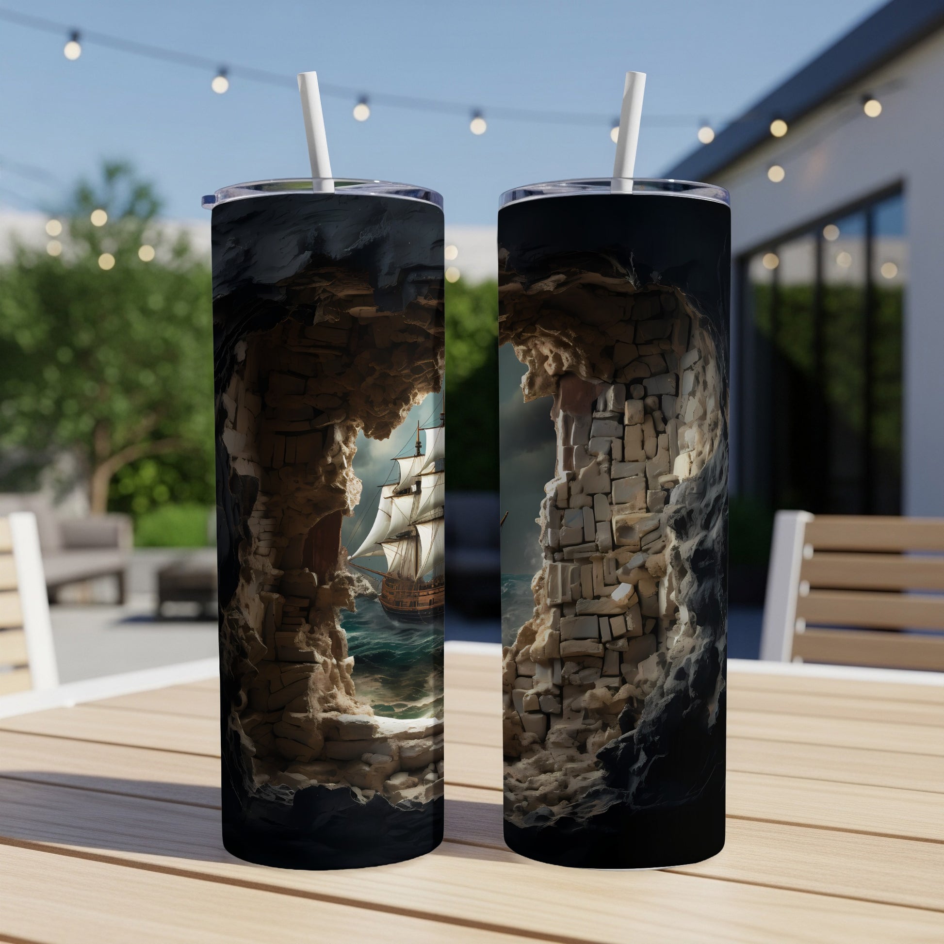 Two tumblers displaying a ship sailing through a rocky cavern entrance.