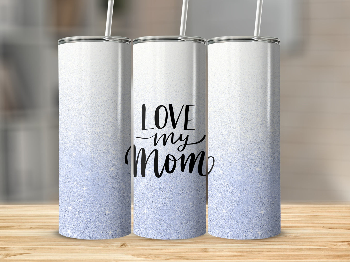 Tall white tumbler with "LOVE my Mom" in cursive, light blue glitter gradient.