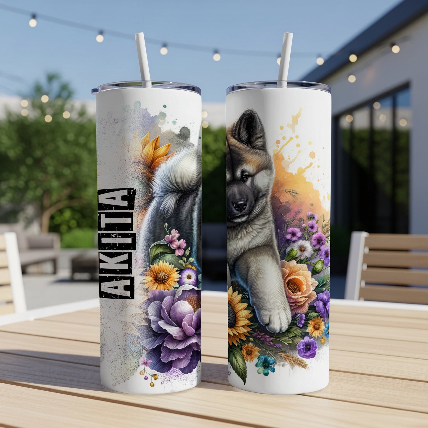Akita dog design on two white tumblers with floral accents.