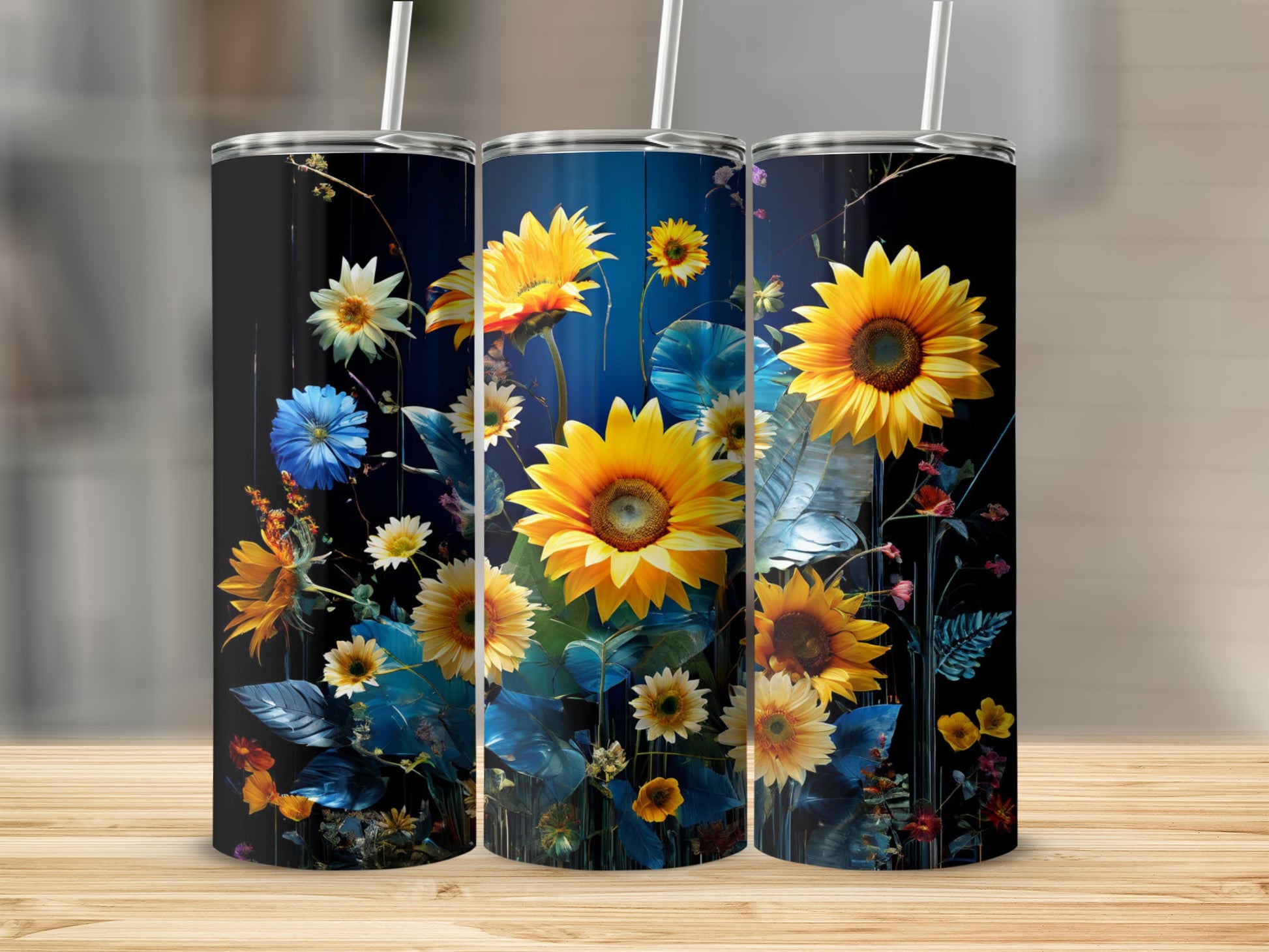 Three tumblers with sunflowers and blue flowers against a dark, textured background.