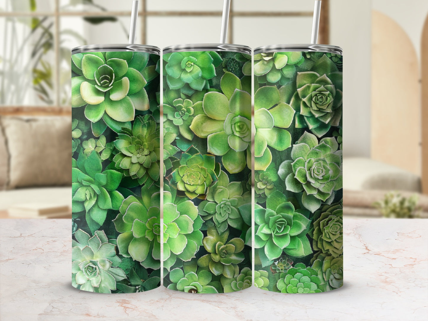 Three tumblers with a succulent plant pattern, displayed on a marble surface.