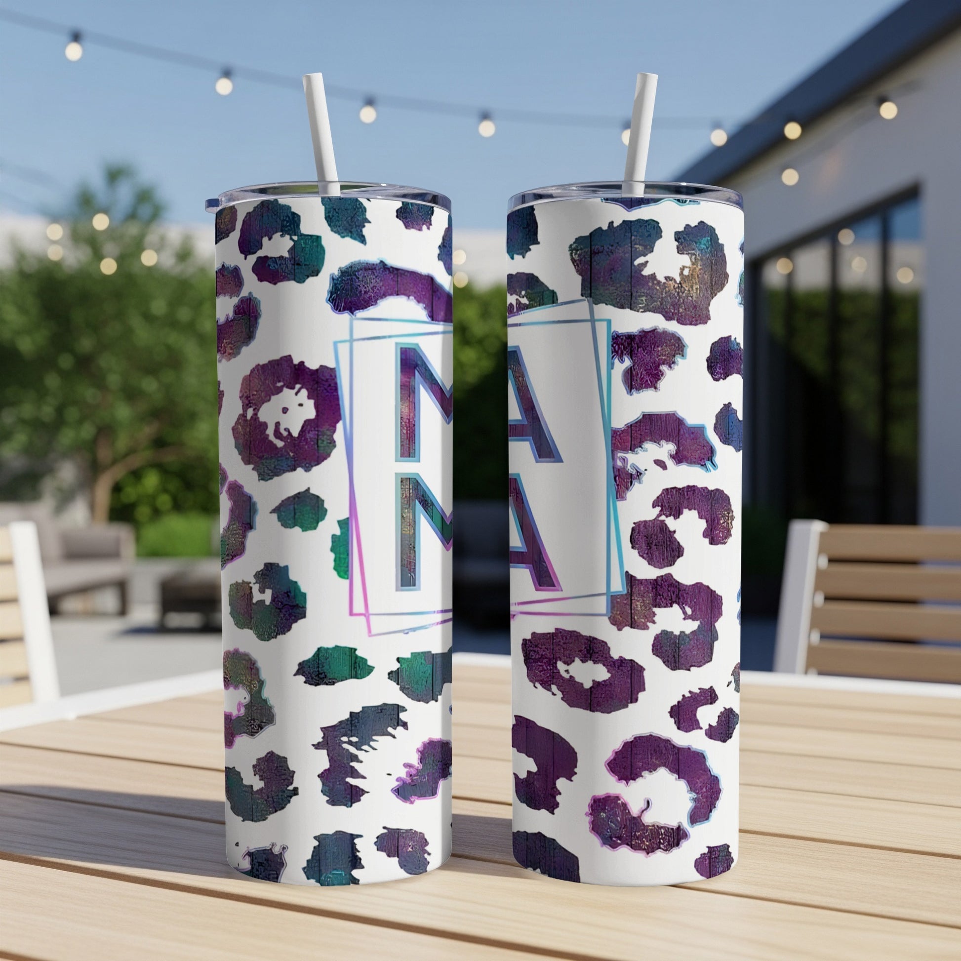 Two tumblers with iridescent leopard print and "MAMA" text.