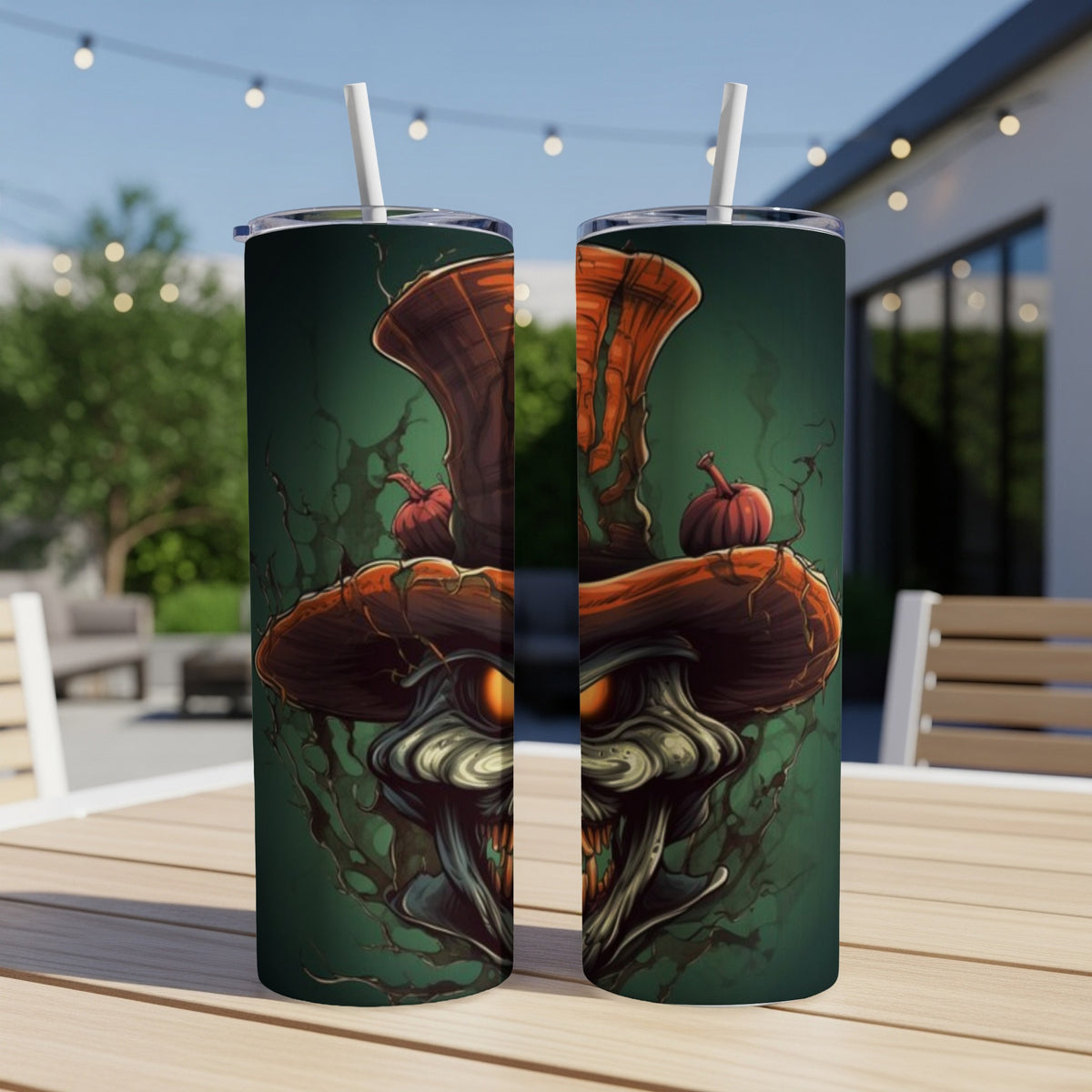 Two tumblers with a Halloween scarecrow design, featuring pumpkins and eerie eyes.