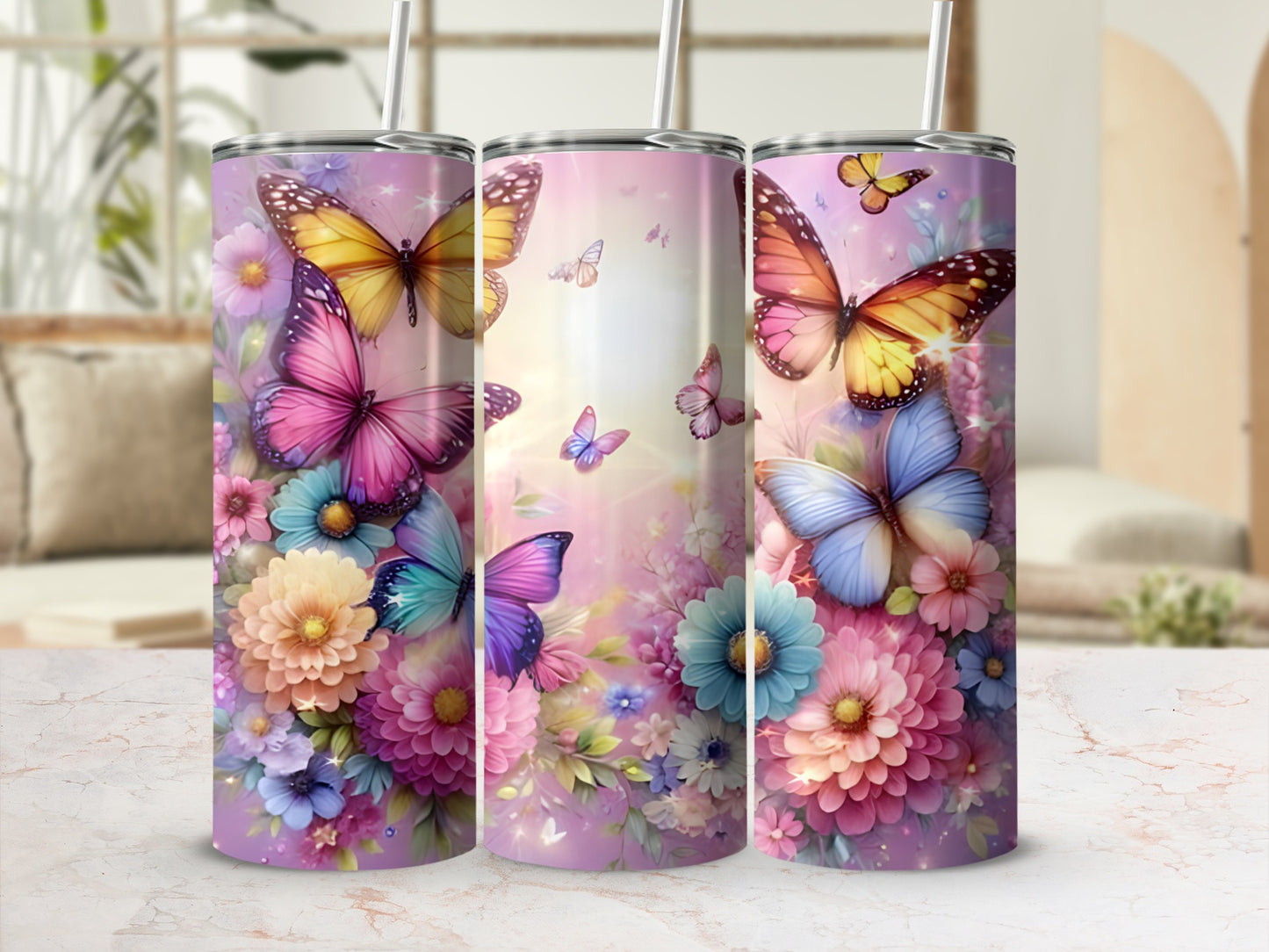 Three tumblers decorated with butterflies and floral designs.