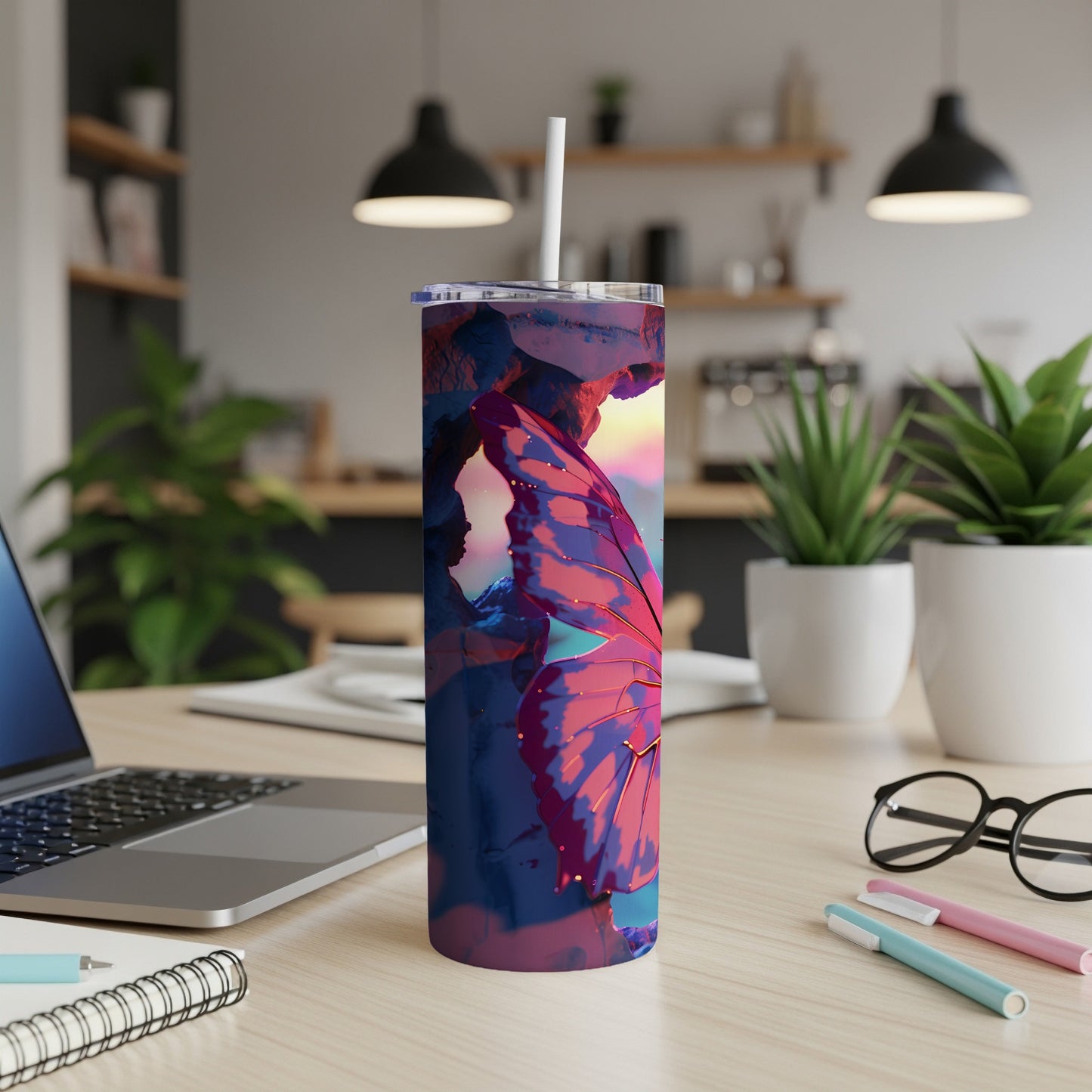 Tall, insulated tumbler with a colorful butterfly wing design.