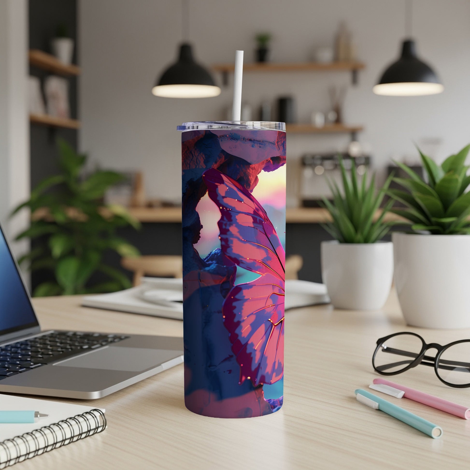 Tall, insulated tumbler with a colorful butterfly wing design.