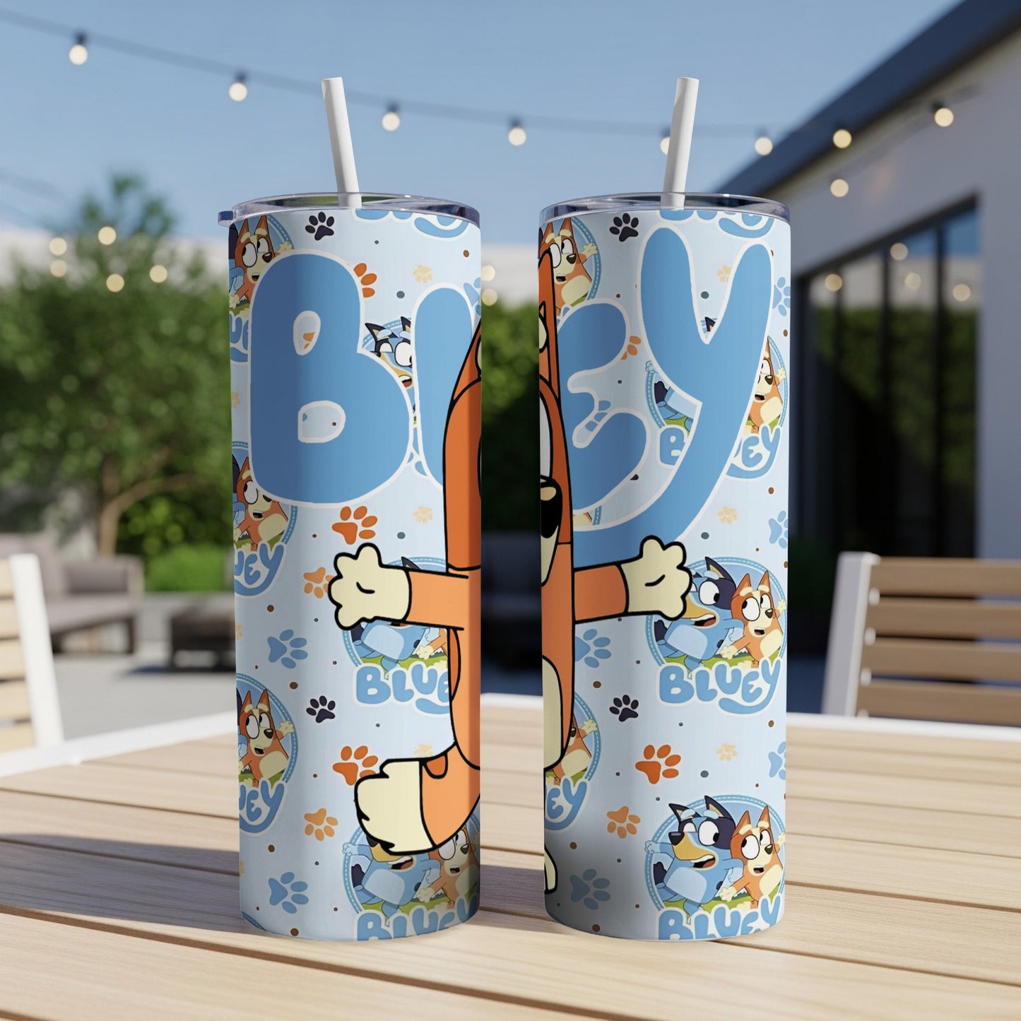 Bluey and Bingo characters on a light blue patterned skinny tumbler with straws.
