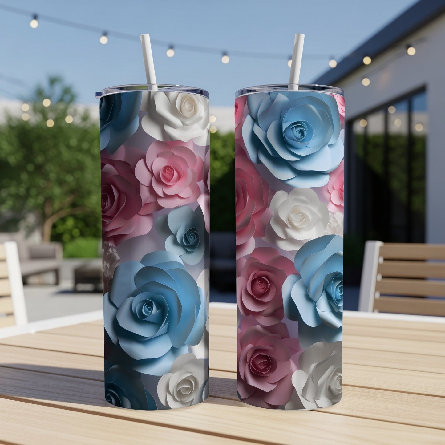 Two tumblers with floral patterns of pink, blue, and white roses.
