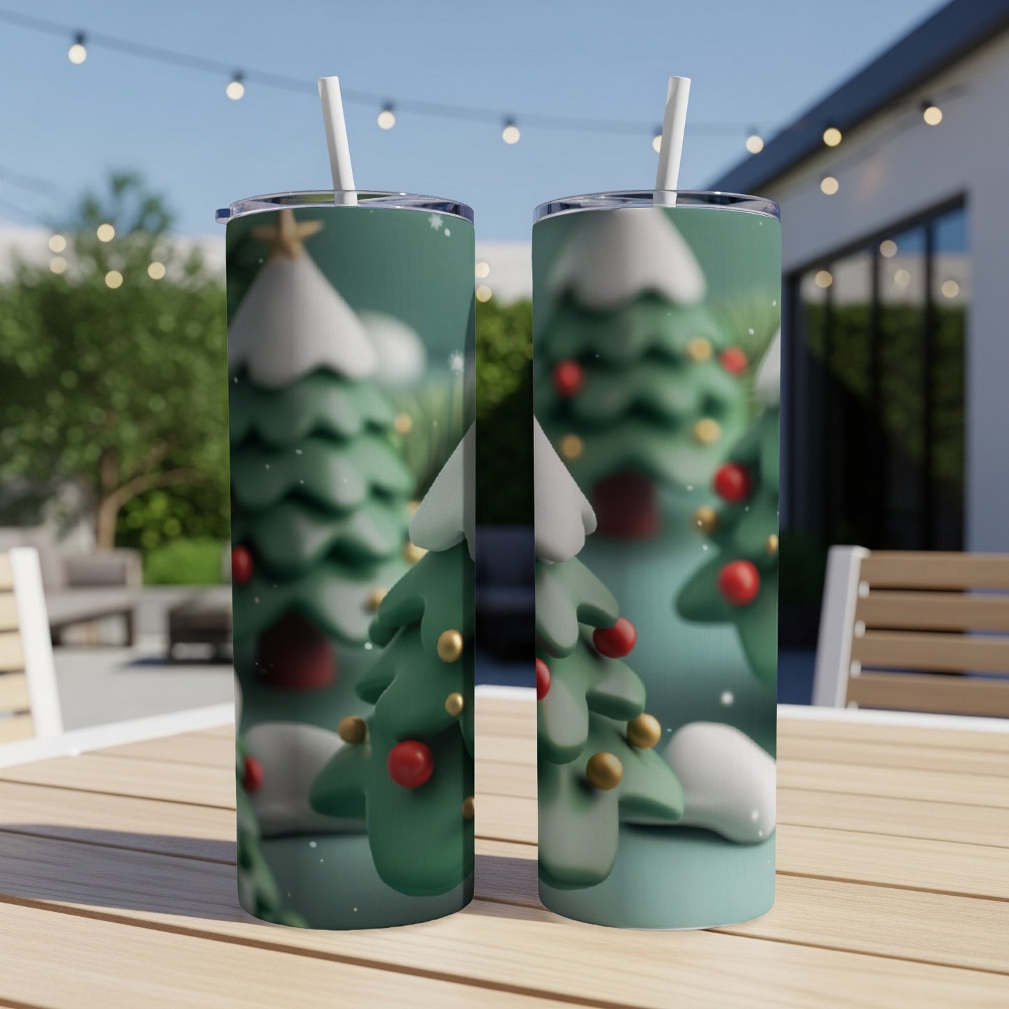 Two insulated tumblers with a snowy Christmas tree pattern.