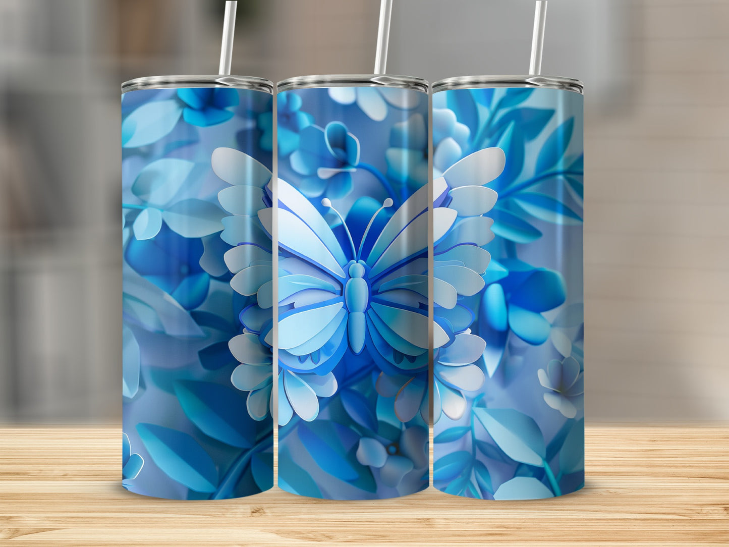 Three blue tumblers with butterfly and floral pattern.