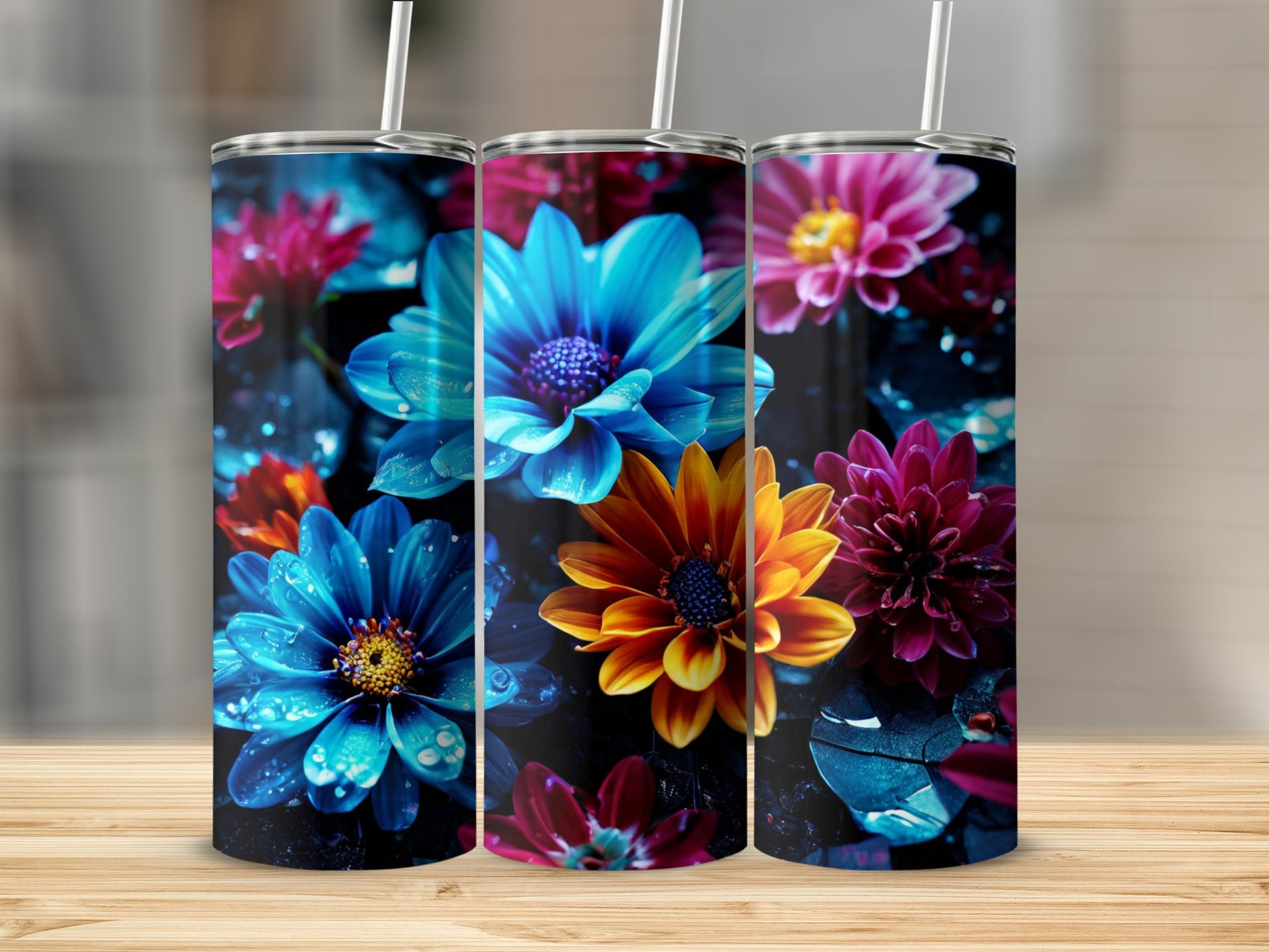 Three tumblers with vibrant, dewy floral designs.
