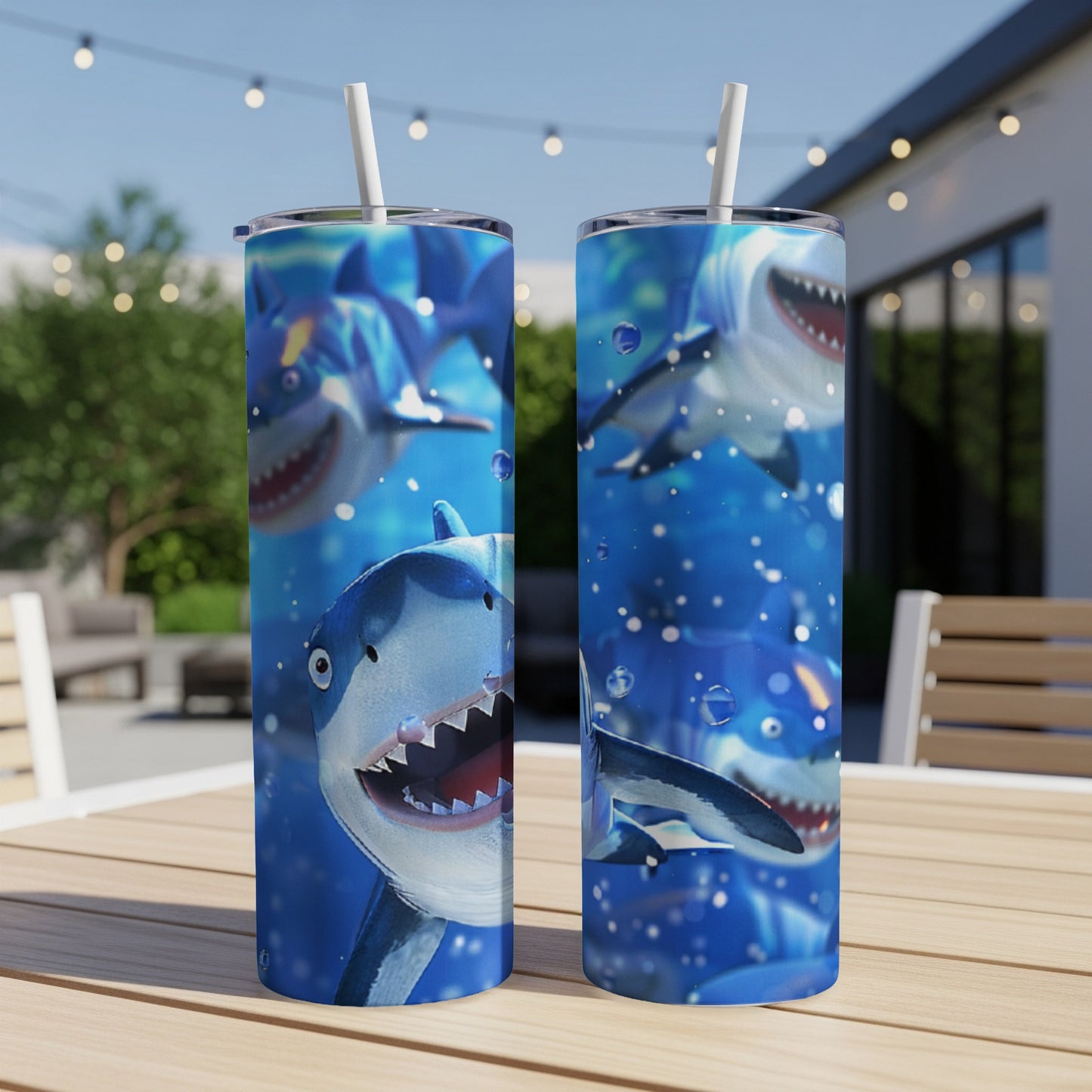 Two tumblers with cartoon sharks swimming underwater with bubbles.