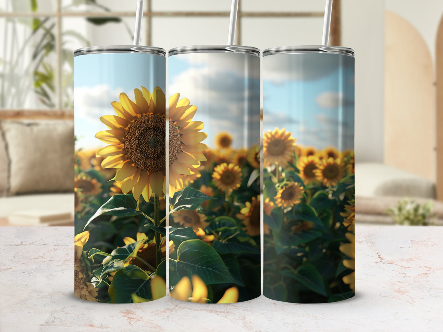 Three tumblers with sunflowers in a field, front and center.