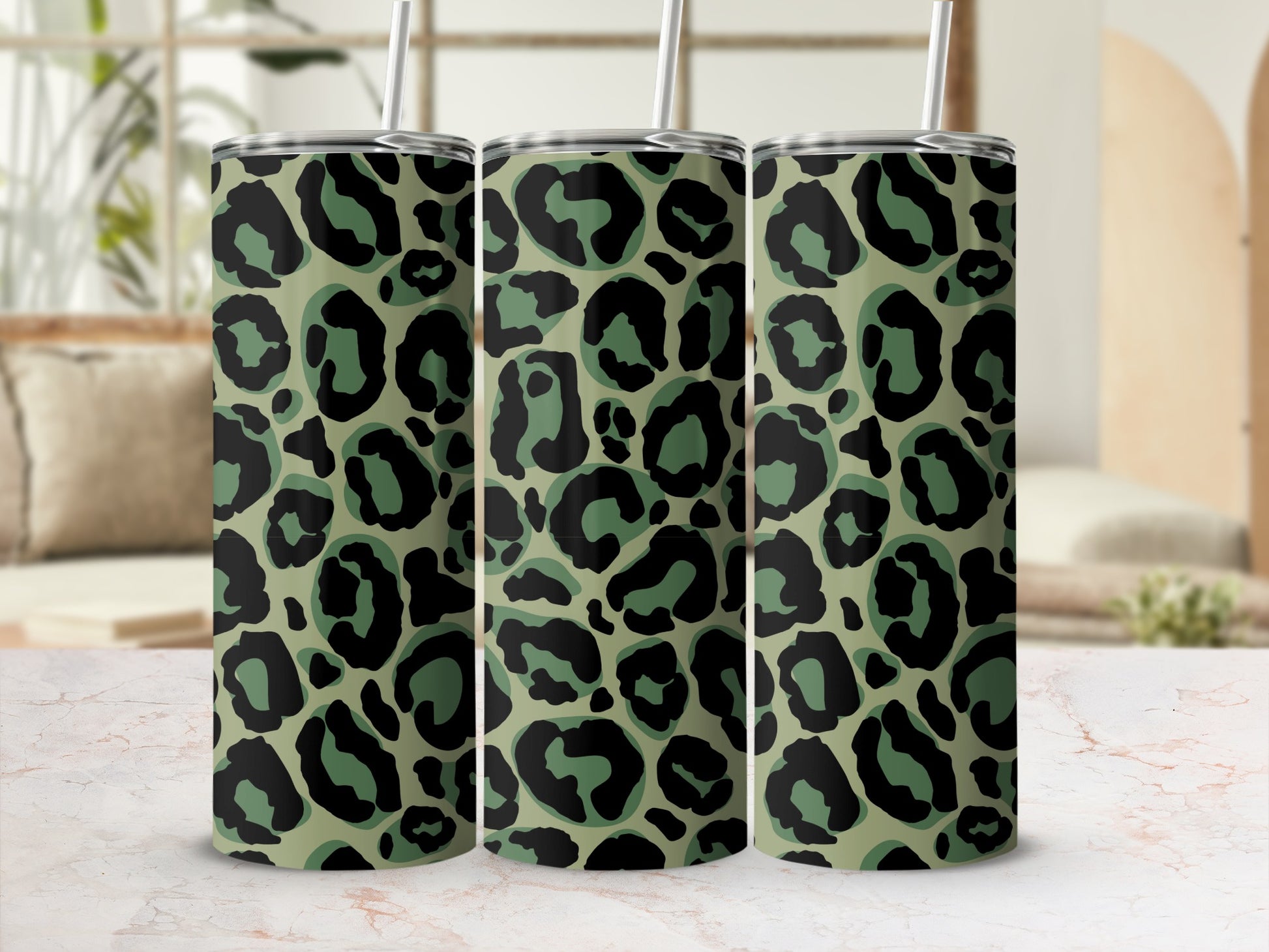 Three tumblers with a green and black leopard print pattern.
