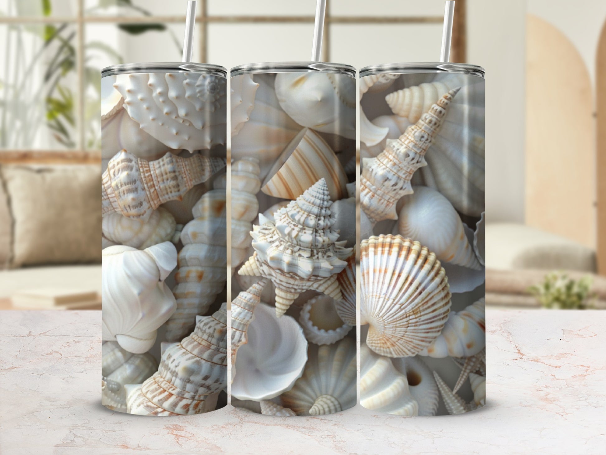Three tumblers with a close-up pattern of various seashells.